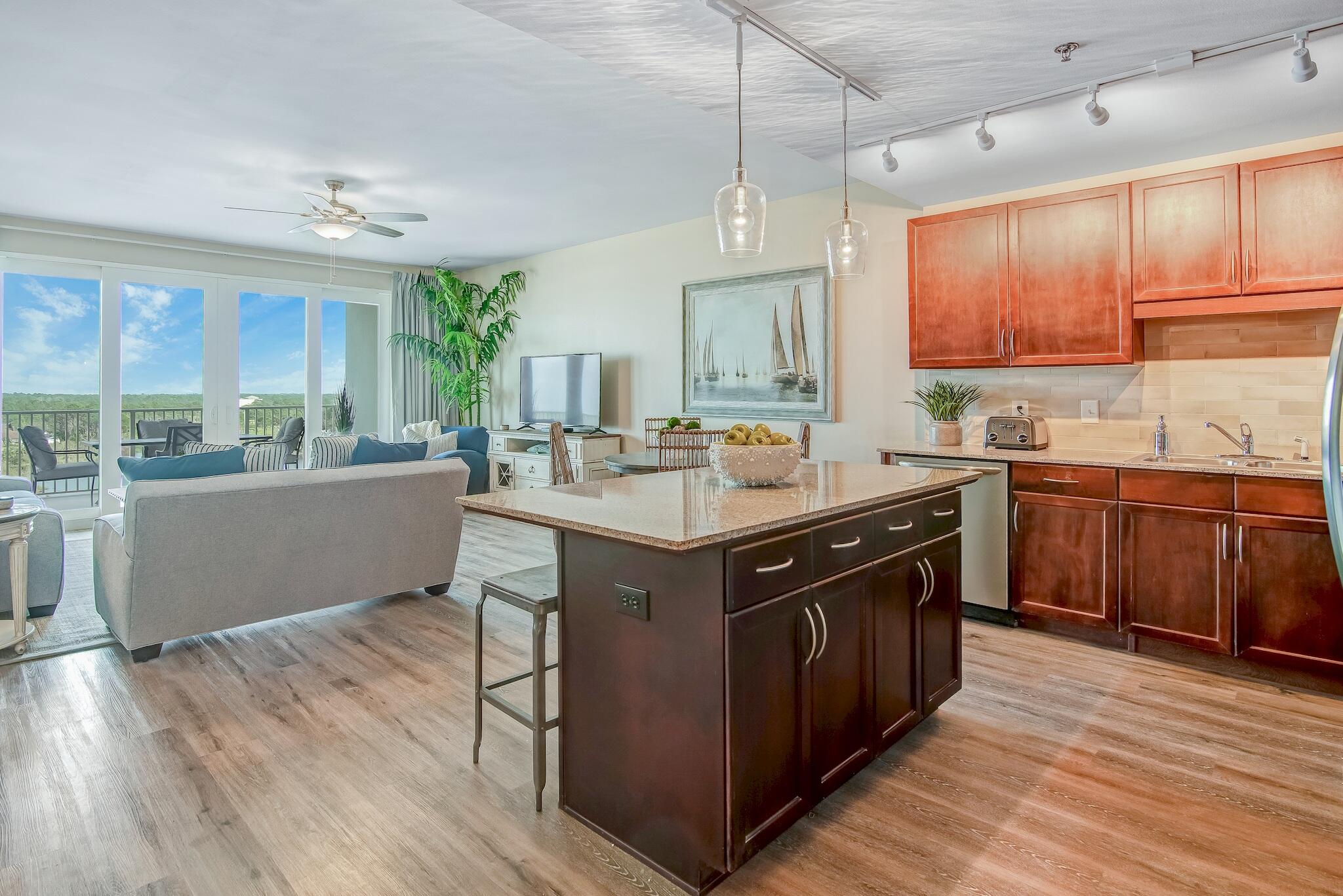 Step inside this beautifully maintained Laketown Wharf condo offering 3 bedrooms, 3 full baths, and a separate bunk room, designed to comfortably host 10 guests. The kitchen is equipped with granite countertops, a full stainless steel appliance package, tile backsplash, and a convenient breakfast bar. Luxury vinyl plank flooring flows throughout, and the spacious balcony overlooks the tranquil lake for the perfect sunset backdrop.Located in the heart of Panama City Beach, Laketown Wharf places you steps from all the excitement. This beachside resort provides incredible amenities including direct beach access, five distinct pools, the Splash Bar & Grill, a Gulf-view fitness center, and covered parking in the onsite garage. The property showcases stunning views of the Gulf, lake, and-->> golf course depending on vantage point. Residents and guests also enjoy the nightly fountain and light show and the 52,000 sq ft lakefront boardwalk lined with shops and eateries.