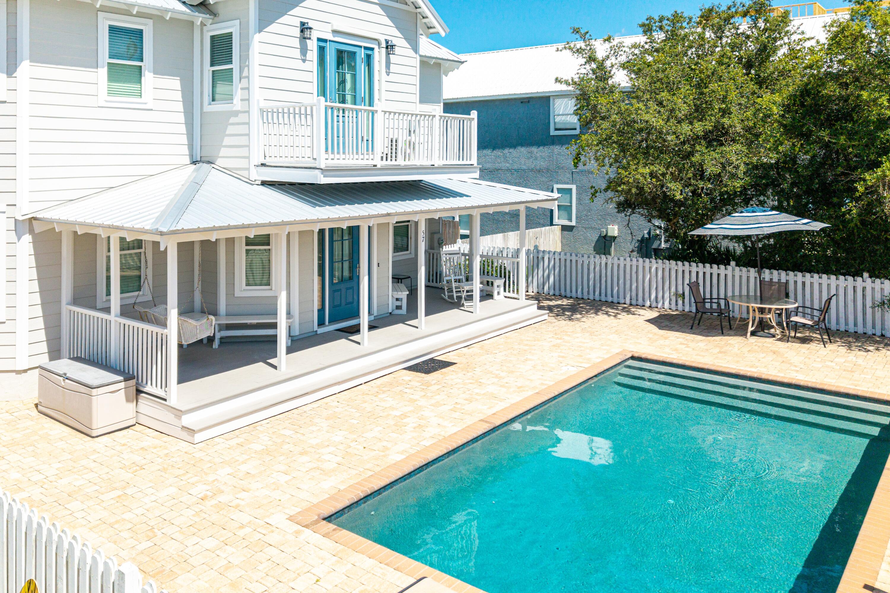 300 feet to expansive deeded beach access! Under $1.6m with 4 bedrooms, pool and no HOA! $139k in rental projections. Nestled just three homes away from the scenic 30A in Seagrove Beach. Situated a mere 1/10th of a mile from the pristine white sands, this four-bedroom, three-and-a-half-bathroom home is an ideal vacation beach home.  There is room to convert back room into 5th bedroom or expand in rear adding square footage. Offered fully furnished, it's primed and ready for new owners to enjoy or use as a turn-key investment.
Lovingly maintained over the past 13 years, the home boasts numerous upgrades, including a new metal roof, newly installed split unit in the upstairs area, updated bathrooms upstairs, and water heater. Also new hurricane rated windows, doors, and new cement hardie board siding in 2020. Located just two homes north of 30A, you're mere steps from the neighborhood's exclusive beach access at the end of Pelayono more searching for beach parking.  The first floor features a primary bedroom with a full bathroom, along with a spacious, open living area. The modern kitchen is adorned with granite countertops and a tiled backsplash, accompanied by a secondary living space that's perfect for entertaining larger groups. Additionally, a half bath and laundry room open to a generous backyard, complete with a storage shed for bikes and grilling equipment.

Upstairs, you'll discover three more bedrooms and two fully updated bathrooms, comfortably accommodating up to 11 guests. The expansive pool deck at the front is an ideal spot to cool off after a day at the beach, while the covered porch offers a shaded retreat to unwind on the swing. With ample parking spaces, there's plenty of room for guests. 
Located in the sought-after community of Gulf Shore Manor, residents enjoy deeded beach access stretching from Pelayo to Dothan (encompassing 1,200 linear feet of beach). The home is also conveniently close to Santa Clara beach access, featuring a ramp, restrooms, and ample parking.

There is plenty of room in rear of house to add on, or create additional outdoor living area with fireplace, etc. The options are endless on what could be created on this large area.  Privacy hedges or planters could be added around the pool creating a tranquil oasis.