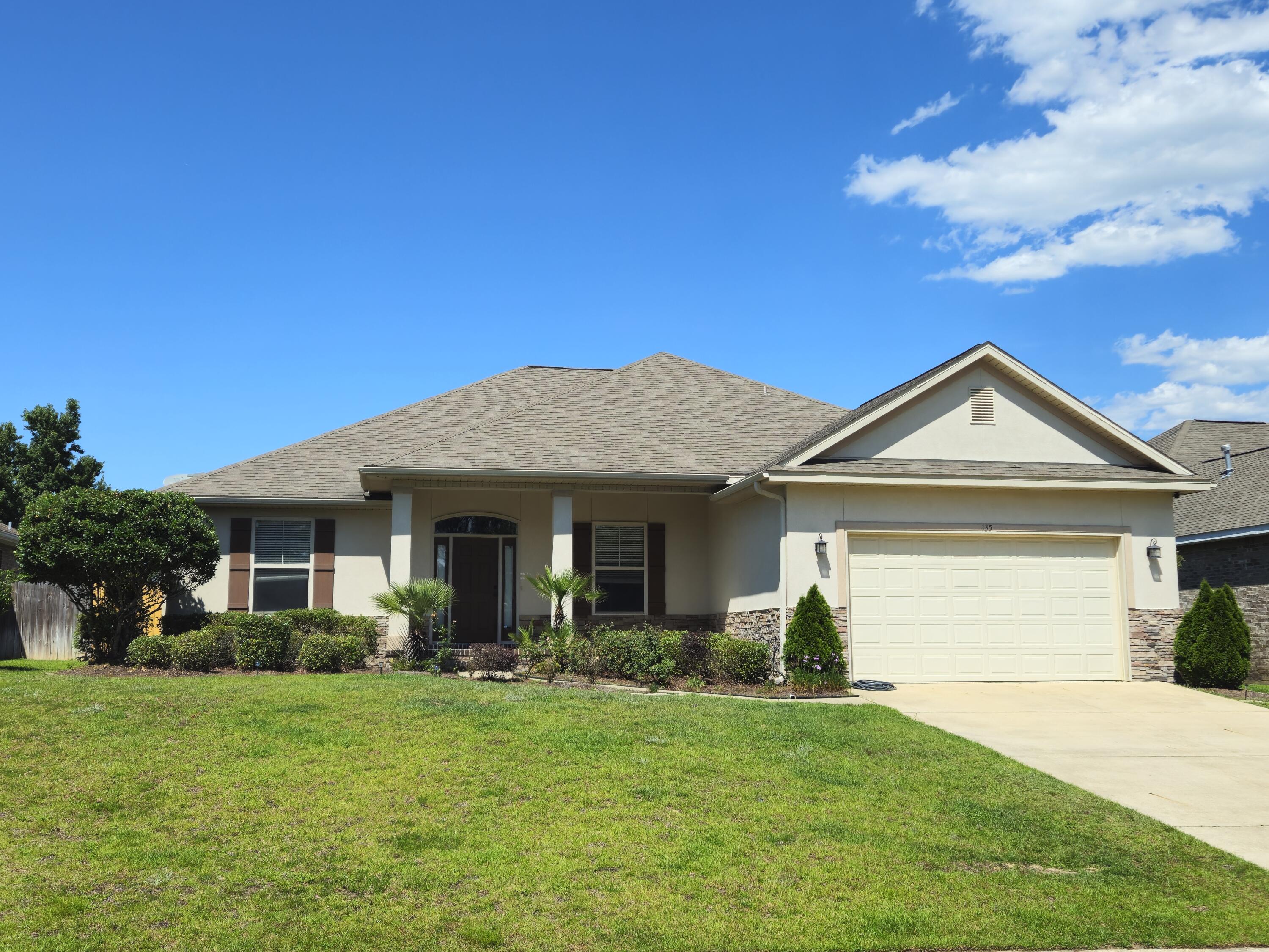Step into this beautiful 4-bedroom, 3-bath home, nestled among majestic pines in Crestview's Shadow Pines neighborhood. Located just off PJ Adams, enjoy quick access to schools, shopping, and a short commute to Eglin AFB and Duke Field.
Inside, 9-foot ceilings soar to 10 feet in the living room and master suite, creating an airy feel. The chef's kitchen boasts granite countertops, custom cabinets, a pantry, and a cozy breakfast nook.
Step through French doors to the under-roof lanai, perfect for relaxing or grilling in the expansive backyard, featuring an irrigation system.
The Jack-and-Jill bath layout, spacious bedrooms, and single-level design make this home ideal. Freshly painted, with new vinyl flooring in the bedrooms and an epoxy-coated garage floor, it's move-in ready.