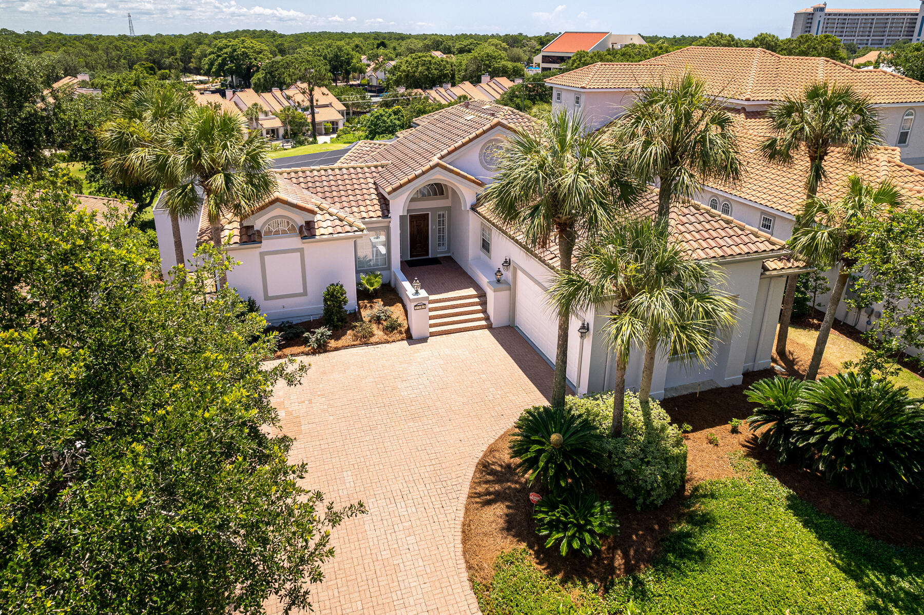 Rare gem single family home just a stroll or golf cart ride from amenity rich Sandestin's private beaches. Take advantage of this well-designed blank palette ready for your personal touches with a freshly painted interior and exterior. This home features a large open floor plan yet each of the spacious bedrooms are private retreats with tastefully remodeled bathrooms. The expansive main floor balcony overlooks the full-sized, screen private pool with access from the Primary bedroom, living room, and guest bedroom. The lower-level poolside family room is complete with kitchenette and wall to wall slider doors. Enjoy the loft that can be an office or hangout spot. The extra-large two car garage has room for a golf cart. Offered furnished.  Concrete block construction. Sandestin is the premier resort on the Gulf. Offering four golf courses, full-service marina, beach access, tennis, fitness center and multiple pools, all accessible via golf cart or resort tram service.