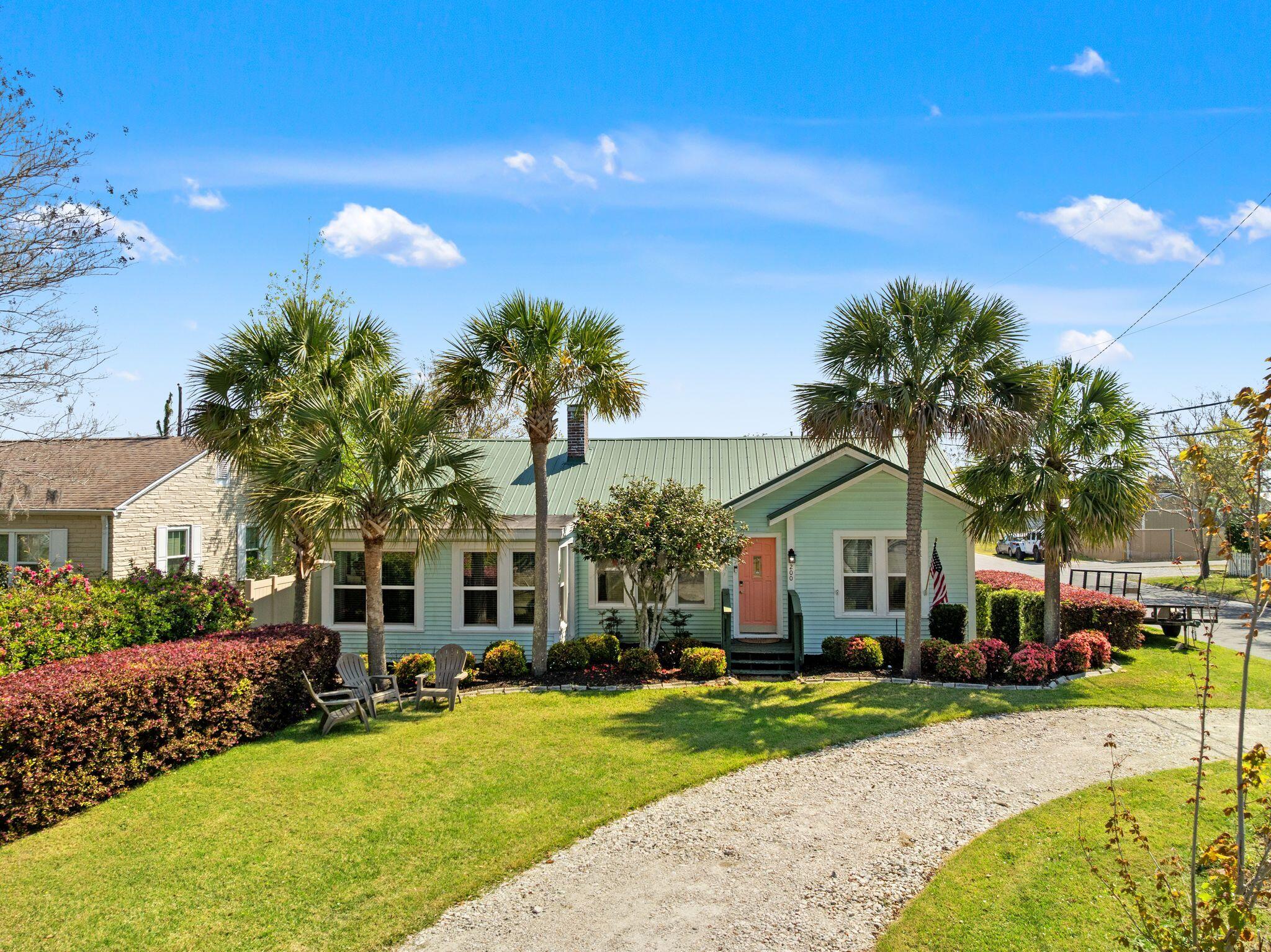 Nestled on a corner lot in the highly sought after Cove community, this charming 3 bedroom, 3 bathroom home offers standout curb appeal, mature palms, and the laid back Florida lifestyle buyers are looking for. With 1,440 square feet, the home blends timeless character with thoughtful updates throughout.

Inside, original hardwood floors remain beneath the newly installed LVP, offering both immediate durability and long term value. The split floor plan provides comfort and privacy, while updated tile in the bathrooms adds a clean, modern touch.

The kitchen serves as the centerpiece of the home, featuring high end stainless steel appliances including a 6 burner gas range, matte granite countertops, a functional breakfast island, glass tile backsplash, and freshly painted cabinetry,  creating a bright and updated feel ideal for both everyday living and entertaining.

A large detached building sits at the rear of the property, offering excellent flexibility for a workshop, gym, studio, or additional storage. The structure includes spray foam insulation, a window unit for cooling, and a roll up door for easy access, making it well suited for vehicle or golf cart use. With further improvements, this space presents a strong opportunity for expanded functional use and potential value enhancement.

Located just around the corner from St. Andrews Bay Yacht Club within a golf cart friendly neighborhood, residents enjoy easy access to the bay along with a short drive to historic downtown Panama City for dining, shopping, and entertainment. A new HVAC system installed in 2024 adds comfort and peace of mind, and a separate irrigation water meter helps keep outdoor utility costs efficient.

Schedule your private showing today and experience the character, flexibility, and location this Cove property has to offer.

Golf cart conveys with an acceptable offer, making it easy to take full advantage of this golf cart friendly neighborhood.