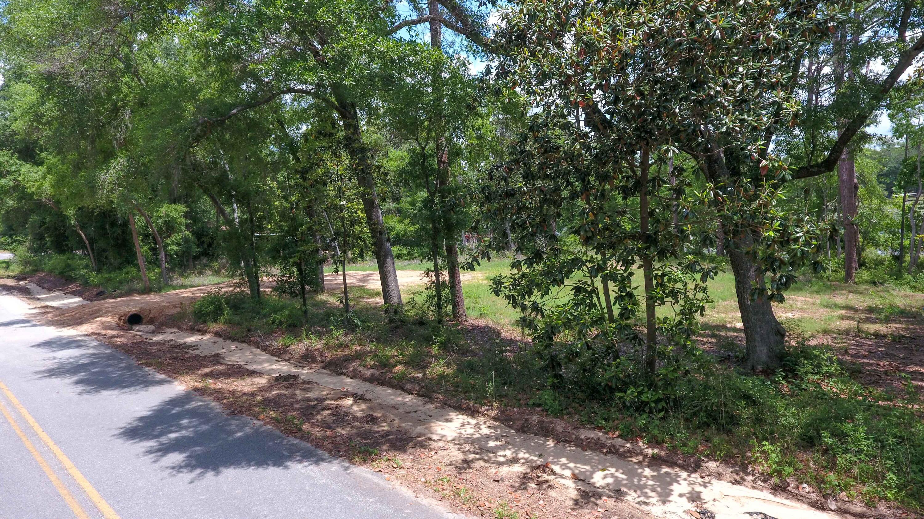 Don't miss this opportunity to own a waterfront lot on Juniper Lake! Located a stone's throw from Cat Island Park which features boat/canoe access, grills, pavilions, picnic tables, and restrooms. Best of all, no HOA dues! The lot has been cleared and ready for you to build or place a mobile home. Loads of dirt have been brought in and a culvert pipe installed to make a driveway for access to the property. With 85.77 feet of waterfront view on Juniper Lake, call today to check out this view!