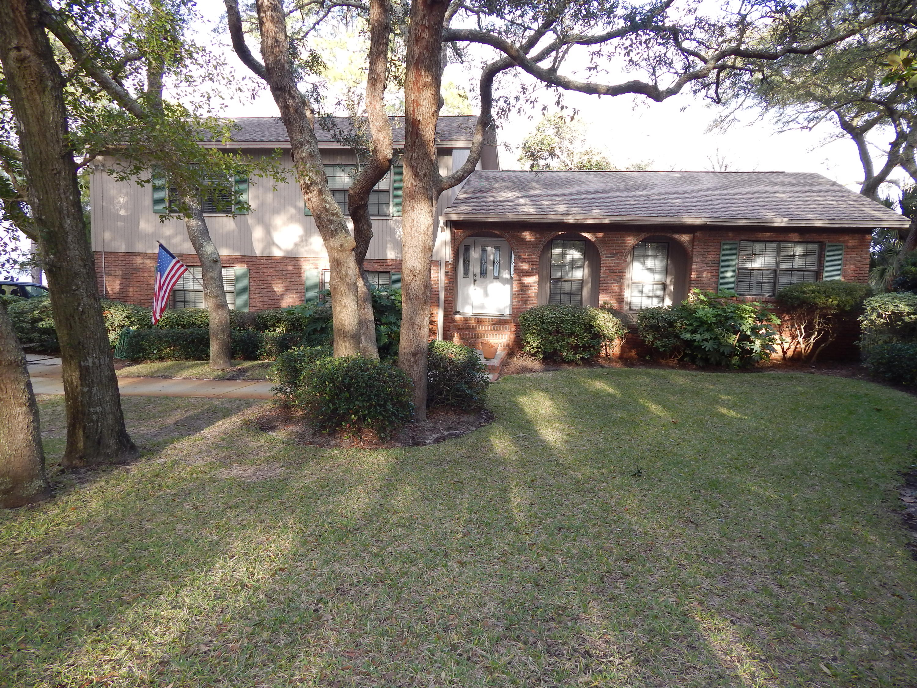Accepting back up Offers! 100ft of Waterfront on Choctawhatchee Bay! Look out your back door and see Destin in the Distance! Ideal Location and good elevation! This Lovely, well-cared for Brick home is located on a spacious wooded lot in Elliot Point. GRAND Waterfront Views from the Master, Living, Dining and Family Room!
The Large, Bright Living Room adjoins the Eat In Kitchen, Family Room & Dining Room and opens to the Large Deck - PERFECT for entertaining! The Huge Kitchen has ample Corian Countertops, Maple Cabinets, Stainless Steel Appliances, Tiled Flooring, Tiled Backsplash, Long Breakfast Bar and SPACIOUS Breakfast room! New designer ceilings enhance the downstairs Recreation room complete with wet bar, half bath and built-in office/computer area. Upstairs, the three Bedrooms are generously sized. The Master Bedroom has crown molding, walk-in closet, double -raised sinks in the bath. and Breathtaking Waterfront Views from the Balcony!  The Guest Bedrooms are generously sized. One has a walk-in closet!  There is also a long storage room next to the garage!  Outside and Inside, the views are Spectacular - especially the Sunrise!  There is a sprinkler system/lawn pump; an outdoor shower, wood composite decking and the extra long & wide driveway has quality pavers!   The Dimensional Shingled Roof and sea wall were both new in 2005. Pilings are in place for dock and boat lift (some repairs to dock are in progress.)  Great, established neighborhood convenient to Beach, Bases and Shopping!    Sellers can close now or later - They are very flexible on a closing date.  This home is a pleasure to view!  Call to see it today!