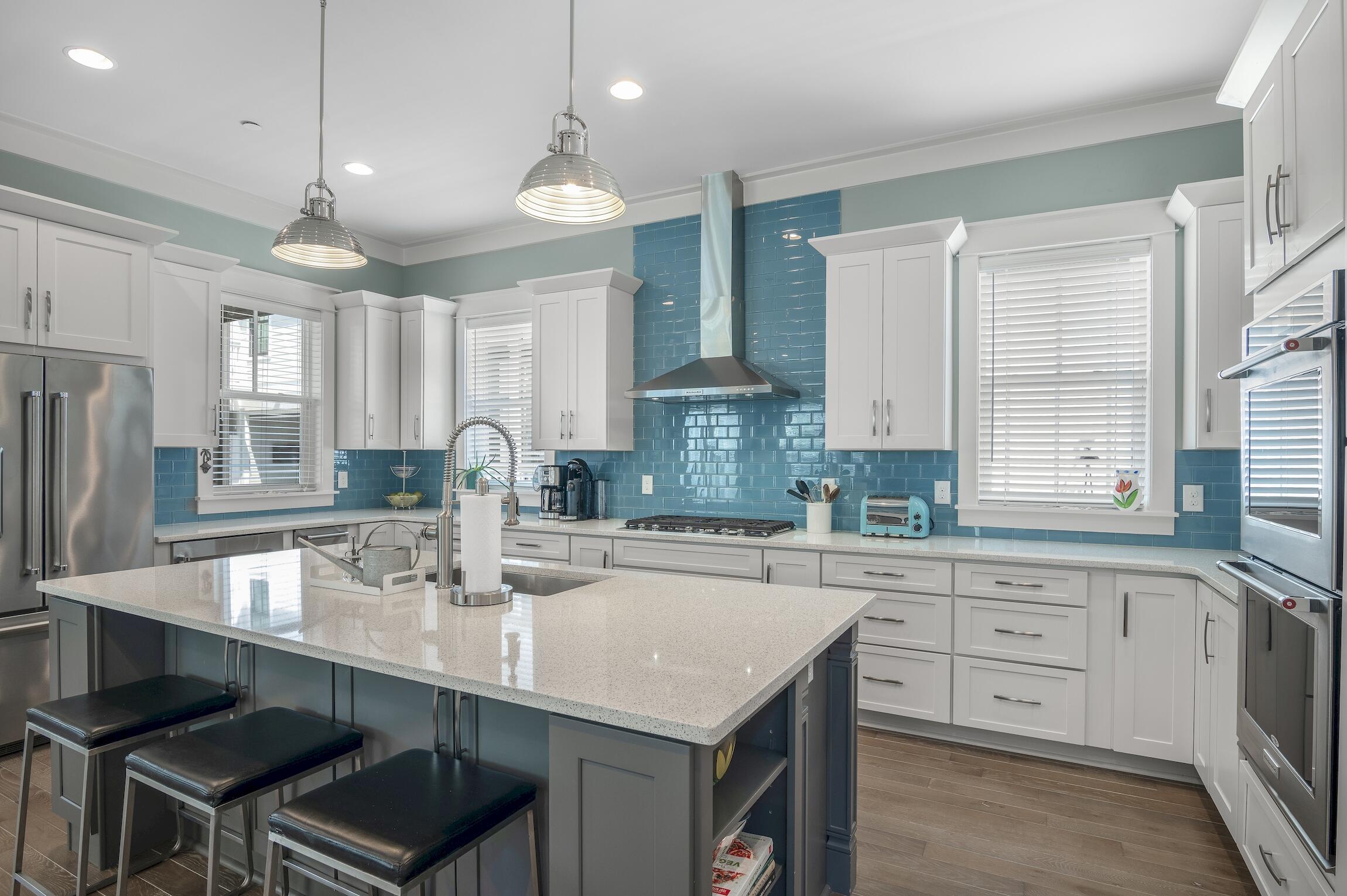 Set in an exceptional location close to Eastern Lake and beach access, this custom built beach cottage is hard to surpass. The condition of this home reflects the pride in ownership of the owner occupants who have never rented the home and the quality of Luke & Blue's construction. Inviting indoor and outdoor living space along with a fabulous chef's kitchen provide the perfect backdrop for making wonderful memories in your 30A home. Cooks and entertainers will appreciate the gourmet kitchen, which is filled with light from the windows and pendant lighting above the generous island. Above and beneath the quartz countertops, there is abundant storage. The stainless KitchenAid appliances include double ovens, a beverage refrigerator, ice maker and a five-burner gas cooktop. The dining area is surrounded by windows and open to the spacious living room featuring a gas fireplace with blue tiled surround and wooden mantle. The open concept floorplan is wonderful for living and entertaining. The indoor living space extends naturally outdoors onto the screened rear porch with views of the newly turfed yard and shades for when you want more privacy. The fully fenced yard has a paved patio and grilling area. Before heading upstairs, check out the first-floor guest bedroom with full bath, pantry, half-bath and one-car garage perfect for corralling beach gear, bikes and a golf cart. On the second floor, the huge primary suite boasts an enviable bathroom with twin vanities, a walk-in shower and soaking tub. The adjoining screened porch is a private haven complete with new swing bed. The generously-sized owner's closet has potential to be converted into a bunk room if you need more room for guests. The 4th bedroom located within the primary suite is the ideal nursery or home office. There is a separate guest bedroom upstairs along with the laundry room and more storage/hobby space. Outdoor adventurers, beach lovers and nature enthusiasts will be totally smitten by the location. Just steps away, serene Eastern Lake offers kayaking, paddle-boarding, fishing and bird spotting on the rare dune lake. Take your pick from two access points to the beautiful white sandy beach nearby. If that's not enough, the newly renovated community pool is at the end of the street. Most of the furniture is available with this fabulous home, which is within easy walking distance of the Old Florida Fish House and Buddy's Seafood Market. This location along 30A is the best of both worlds with less congestion and easy access to all of your favorite spots in the area.