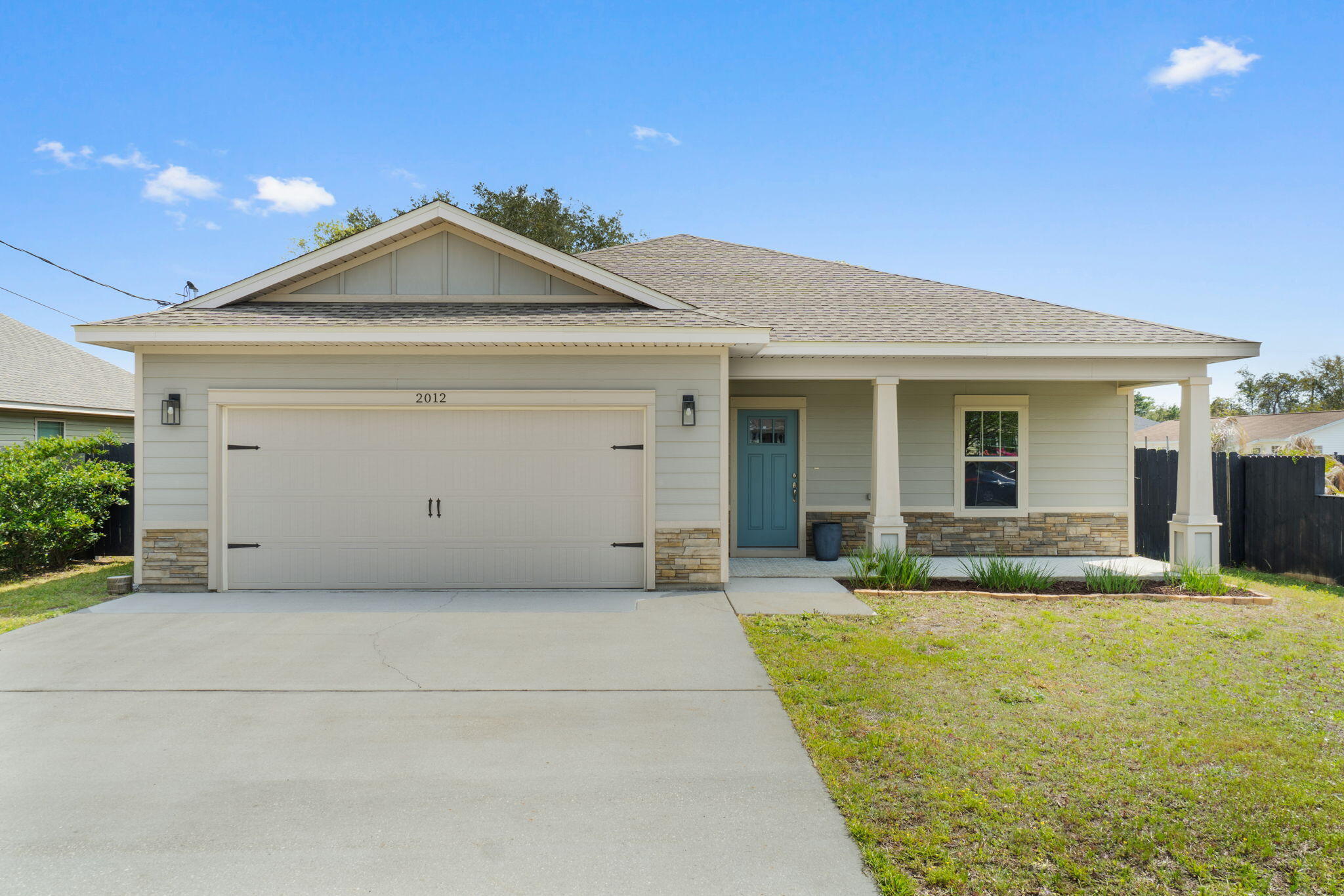 Welcome home to this stunning craftsman style Ramsey & Walker built east Navarre home improved with lovely customizations featuring 3 bedrooms and 2 baths just a half a mile from the Navarre Beach Bridge! You'll love the easy commute to Hurlburt Field while also being only minutes to Navarre's beautiful beaches. 

Pull up the driveway in front of the two car garage and walk to the front door where you'll find an adorably painted covered front porch inviting you in. Through the threshold a long open entryway will greet you with a trey ceiling accented with crown molding and a front entry closet and accent wall with board and batten. 

The open floor plan awaits you with a large living space adorned with hard surface flooring open to the stunning kitchen. Adorned with all the updated features you're looking for, you'll love the custom tall cabinets with tasteful hardware, the granite counters, the large island with plenty of room for seating, the stainless steel appliances, tasteful tile backsplash, drop down pendant lighting, and the spacious pantry. Off the kitchen is the dining room featuring another trey ceiling and a gorgeous accent wall, and the back door leads outside to the fenced in backyard complete with a sprinkler system, mature oak tree, and fire pit! Back inside the split floor plan features bedrooms on either side of transom windows which provides a nice high end custom touch. The master bedroom is a fantastic and spacious retreat with a trey ceiling and crown molding and a master bathroom with gorgeous granite double vanities, a tiled shower with soaking tub, and a massive walk in closet! The other two bedrooms on the other side of the home are nice sized with ample closet space, and a beautiful bathroom with matching finishes between them along with a hall closet. The interior laundry room has the same tiled floor as the bathrooms and leads to the garage. 

You're minutes from Navarre Beach, Navarre High School, the YMCA, Navarre Youth Sports Association, as well as dog parks and walking paths. Don't delay in making this your perfect retreat for a primary residence or investment property!