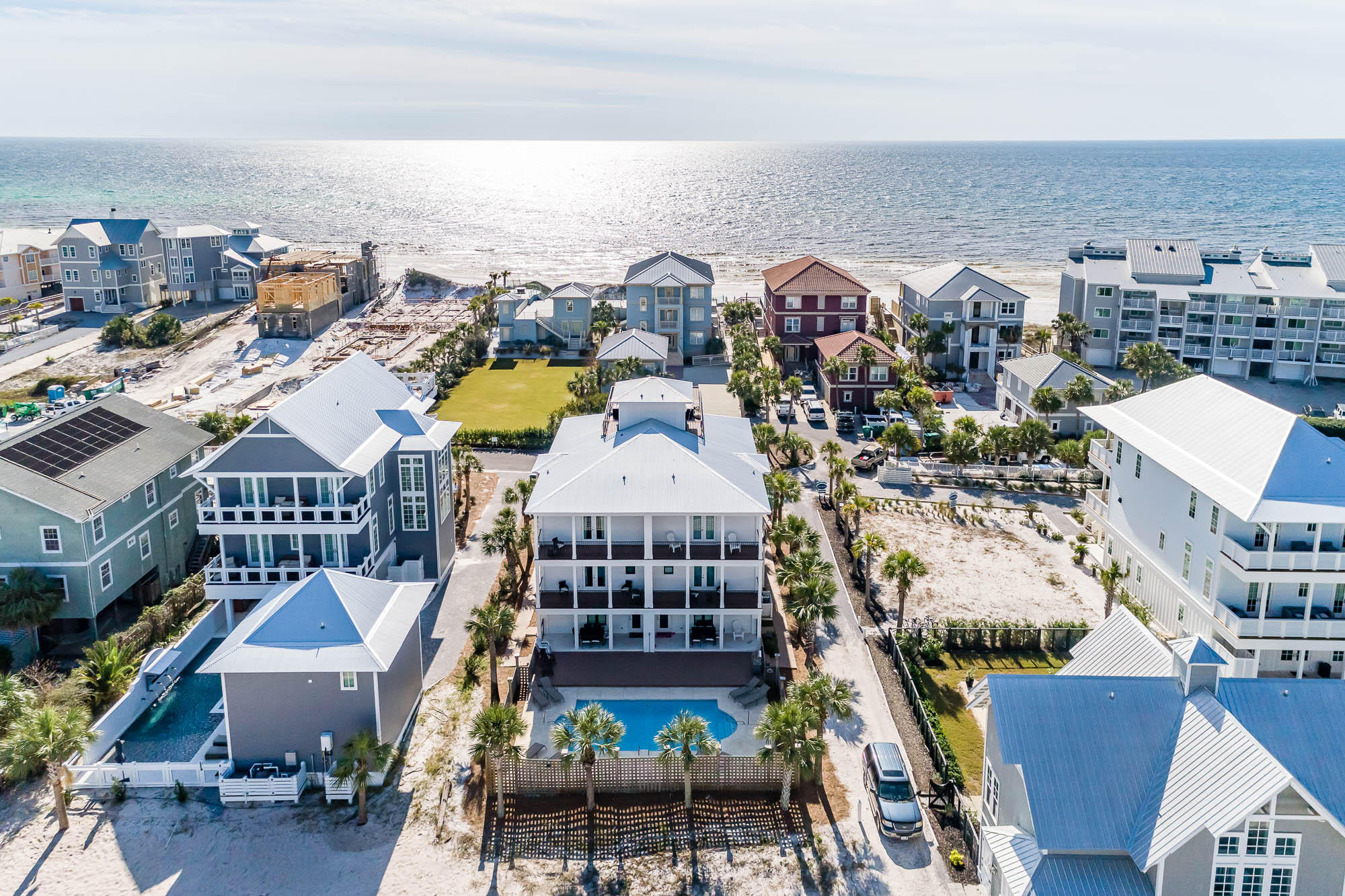 Astonishing views of the Gulf of Mexico along with incredible architecture exemplify this fully renovated luxury duplex situated steps away from the sugar white sands of the Emerald Coast! Located in Seagrove Beach, 156 Chivas Lane offers two separate units each containing four bedrooms and four bathrooms. Exclusive beach access is deeded to this property located at the end of the private street. Offered professionally furnished, this property includes lavish fixtures, designer finishes, a vast rooftop terrace, private pool, large lot, two separate two car garages, an open concept living space, chef's kitchen, and much more! Renovations include all new exterior siding; a new roof; new handrails; new decking; new impacted rated windows; fresh exterior and interior paint; new flooring; new trim; new countertops; new appliances; new custom tile; etc. Positioned in the heart of Seagrove, this estate offers outstanding access to enjoy all 30A offers including the sugar white sands, emerald waters, world-class fishing, first-rate dining and luxury shopping.
 
The thoughtful floor plan showcases each unit's luxury open concept great room on the third level of the home. From this incredible space, views of the emerald waters can be viewed. A gourmet chef's kitchen featuring a large island and custom cabinetry; along with a spacious dining space, expansive living area, exposed brick walls, cedar wood ceilings and custom trim are relished throughout this level. Additionally, on this floor you will find a roomy guest bedroom and bathroom. 
 
On the second level of each unit, a striking foyer greets your guests. Two large master suites are located just off this entry way. Each suite offers a large bathroom with double vanities, a walk-in shower, spacious closets, designer fixtures and custom tile work. As you travel to the ground floor of each unit you will find a beautiful owner's access and sizable laundry facility. Additionally, the bunk bedroom and bunk bathroom found off the first-floor hallway.  
 
As you exit the rear of the home you will see the large private pool and deck area. Each unit features an outdoor grilling and entertaining space for al fresco dining. The undeveloped back end of the property offers additional space to add a beach volleyball court, bocce court or additional deck space. Lots this size are a rare find along 30A. With great rental income, this property makes the perfect second home or investment property. Containing multiple units offers the flexibility to rent only portions of the property while maintaining secluded owner's quarters. Do not miss this extremely rare opportunity to own one of the few multi-unit properties on 30A!

Buyer to verify all dimensions.