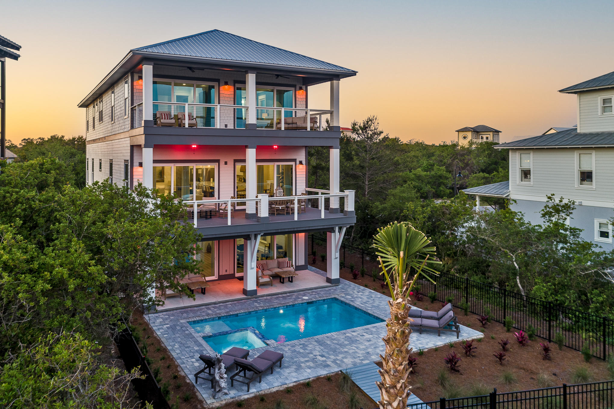 Incredible opportunity to own an immaculate turn-key vacation rental investment home with around $250K in gross rental income for 2021.  

This stunning beach home is less than a year old and has every ingredient necessary for a highly successful vacation rental including a private pool and spa, gulf views, deeded beach access, sleeping for 20+ guests, a full-service elevator, and is now being offered fully-furnished and rental-ready with beautifully-appointed coastal décor and every item needed to begin renting immediately. 

This location is exceptional and is perfectly positioned a short distance to some of 30A's most treasured and prestigious destinations like Rosemary and Alys Beach, both of which are less than 2 miles away... and just 300ft from the house to the sand via the deeded beach access. 

When you enter the home you're greeted by a gorgeous coastal palette of whites and grays, exquisite wide-plank wood floors, crown molding, built-in lockers, and walls adorned with shiplap creating crisp clean lines that flow down the hallways and invite you in.  

This first floor offers 2 large bedrooms and a very spacious bunkroom and flows seamlessly into the game room that is complete with a pool table, foosball table, 2nd living space with couches and TV, plus a wet bar with mini fridge and a wall of glass doors that show off the spectacular saltwater heated pool that glimmers in the background and provides the perfect setting for swimming, lounging, and soaking up the sun. 

As you journey upstairs to the 2nd level you'll encounter a wonderfully open space with high ceilings and plentiful natural light flowing in from the glass doors lining the back wall. 

The kitchen is a dream and was thoughtfully designed with large groups in mind with its colossal island with seating for 8 and 2 dishwashers, 2 refrigerators, 2 ovens, and 2 sinks along with all of the utensils, dishes, and accessories needed to begin renting immediately. 

Also included on this 2nd level are another large bedroom with king bed and ensuite bath, the laundry room with 2 sets of washers and dryers, and a balcony with outdoor kitchen with a fantastic vantage point overlooking the pool deck. 

Continuing on to the 3rd level there's an additional bunk room and 2 spacious master suites with gulf views, private balcony access, and even auto-fill Keurig coffee makers and mini fridges in each room for added convenience. 

These master baths are beautifully designed with custom tile work in the showers, lovely white quartz countertops, and luxurious soaking tubs. 

Shifting now to the outside of the home, there is abundant parking, beautiful landscaping that was newly installed, direct access out the pool gate to the 30A bike path, and deeded beach access across the street and less than a one-minute walk. 

Less than 1 mile to the east is Watersound Parkway which provides quick direct access to HWY 98 making this an easy commute to and from the airport. 

This property is a proven and established cash-flowing asset and is an excellent opportunity for an investor looking to start or expand their 30A portfolio.