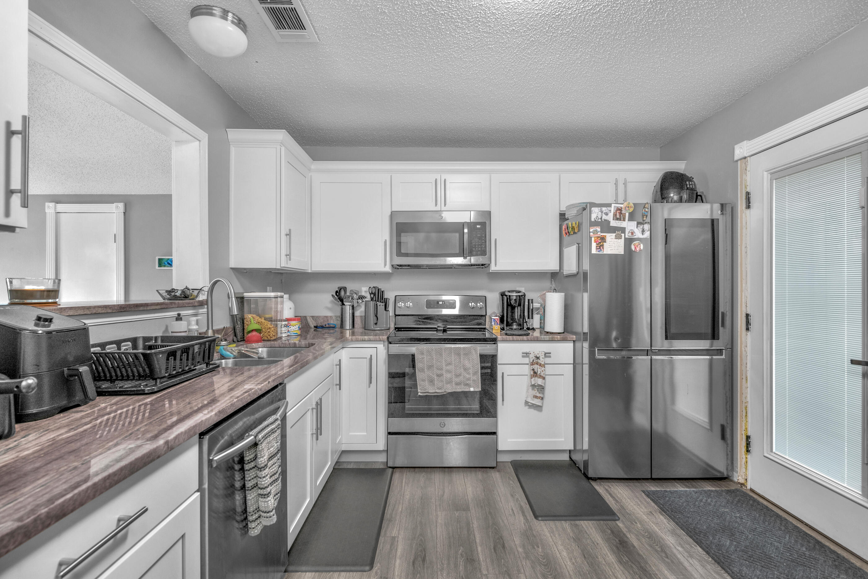 Make your appointment now to see this beautiful 3/2 Home, kitchen with Granite Counter-tops, Stainless Steel appliances, Laminate flooring in main areas, carpet in bedrooms and waterproof Luxury Vinyl in bathrooms.  Fans & lights, blinds, bathrooms, many other extras throughout the home. Roof 2020, AC Outside replaced. Room sizes approx. buyer to confirm.