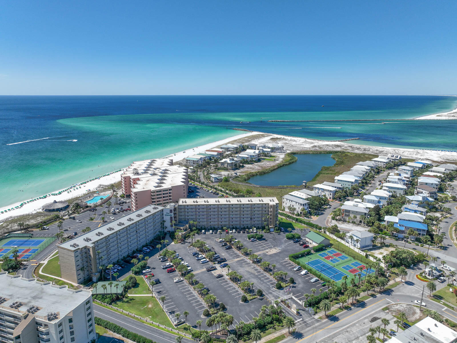 **Charming Coastal Retreat - Unit #114, Islanders Condominium, Destin, FL** 
Discover the perfect blend of comfort and convenience in Unit #114 at the Islanders Condominium. This immaculate, ground-floor unit offers the ultimate in accessibility, allowing you to step right out to beautifully maintained green spaces, with the beach and pool area just moments away. Forget about the hassle of elevators or stairs - enjoy the ease of direct access and nearby parking.

Bathed in natural light, this bright and cheerful condo provides ample space for relaxation and entertaining. The unit features tasteful upgrades, New Appliances and is offered fully furnished. Located in the vibrant heart of Destin, FL, known for its top-rated beaches and as a premier vacation destination, this condo promises an unmatched coastal living experience.
The Islanders Condominium is celebrated for its pristine condition, well-tended grounds, and strong financial health. The building recently passed the SIRS inspection and is set for some fresh painting this fall, all within budget and with generous reserves. Friendly on-site management ensures a welcoming and hassle-free environment.

The resort boasts a wide array of amenities designed to cater to both relaxation and adventure seekers. Enjoy two sparkling pools, with one heated year-round, and unwind in one of the two hot tubs. Stay active with access to a tennis court, four pickleball courts, a basketball half-court, and a mini gym. For those who love outdoor gatherings, the poolside pavilion with BBQ grills and tables is perfect for family and friends. The Islander also provides free beach service, including two beach chairs and an umbrella for each rental. Additionally, you can enjoy a game of shuffleboard or explore nearby kayak and paddleboard rentals.

This condo is not just a delightful escape but also a savvy investment opportunity with strong rental income potential in one of the most sought-after locations in Destin. Don't miss your chance to own this slice of paradise. Schedule your private tour today and experience the exceptional lifestyle offered at Unit #114, Islanders Condominium
***BONUS...... A 70 Day 2026 booking is already on the Books!!! 
Future Booking is transferable to buyer; however, dates and terms are subject to guest cancellations.