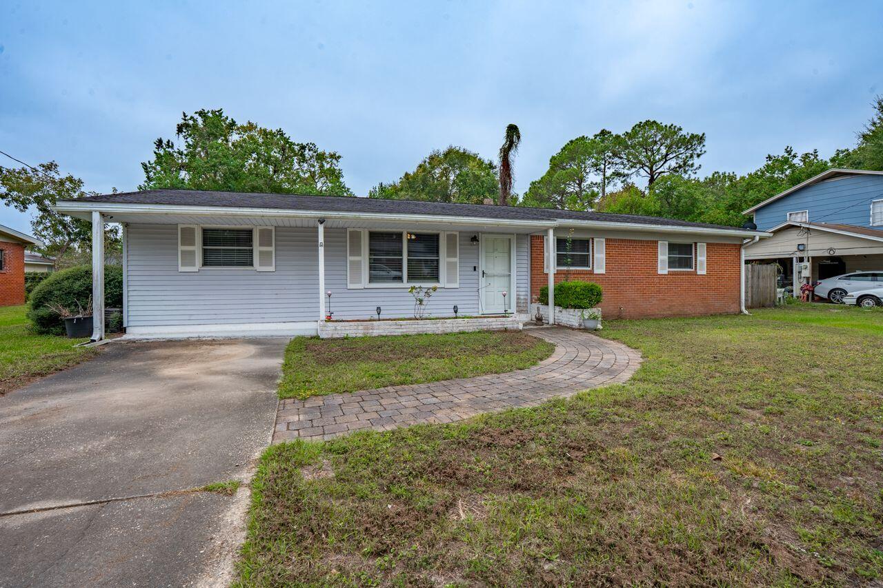 FABULOUS NEW PRICE!  Nestled in the heart of Fort Walton Beach; just minutes from sugar-white sandy beaches, military bases, restaurants & shopping!  Highlights of this charming ranch include custom 'cubbies' for storage...shiplap accent walls...'tuxedo' tile flooing in baths...covered patio...large, fenced backyard...renovated guest bath...brick construction...sprawling quarter-acre lot...large pantry/storage area with washer & dryer (both convey) & outdoor storage building!