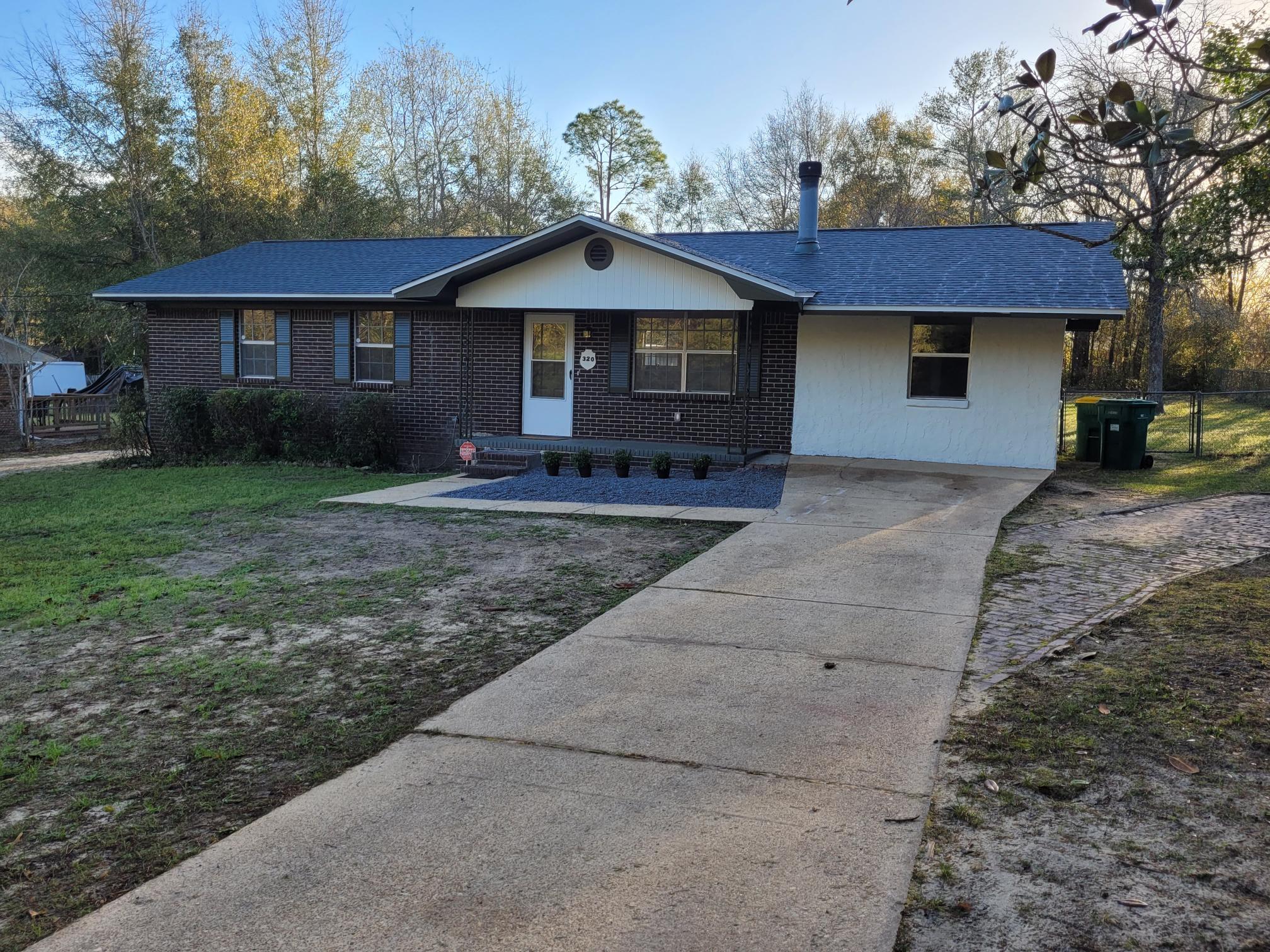 This is a must see, newly renovated, beautiful 4 bedroom, 2 bath home is located in NE Crestview is move-in ready.  This home has been completely renovated with new LVP floors and paint throughout.  It has a 2014 HVAC.  The kitchen has recessed lighting which highlights the new quartz countertops, soft close cabinets, and large peninsula perfect for entertaining.  The open floor plan with a large living and dining area features a beautiful wood burning fireplace and mantle.  The large bedrooms with new ceiling fans have plenty of natural light; the bathrooms have new toilets and sinks. An updated laundry room has plenty of storage and easy access to the 2021 water heater. A spacious and level backyard. Home has so much character.  Don't miss out on this beauty. SUPRA box in rear of house.