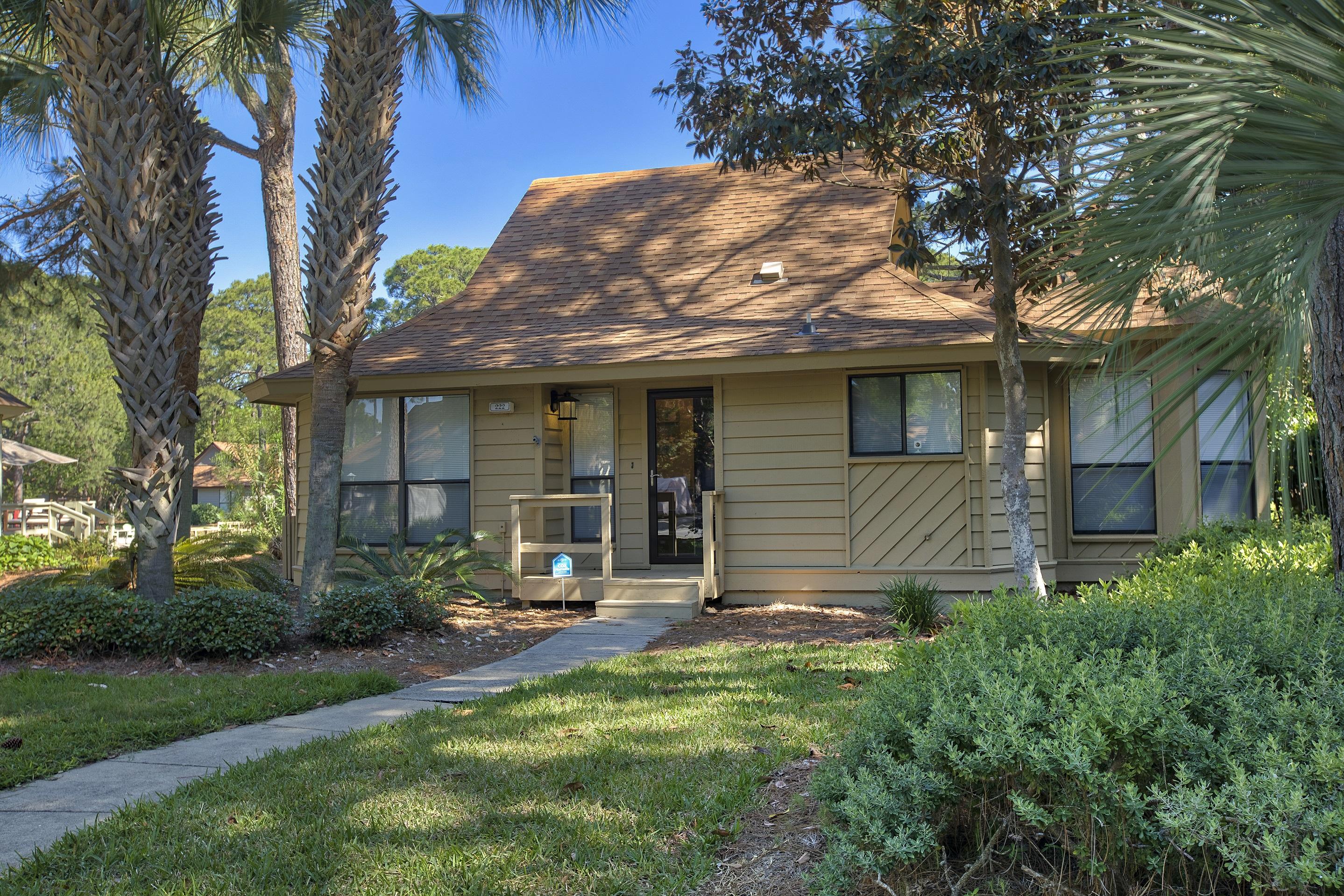 Don't miss your opportunity to view this quaint cedar sided cottage which
is located in the quiet Fairways neighborhood of Sandestin Resort. This never rented & updated 2BD/2BA is offered fully furnished. Latest improvements include complete exterior paint, interior painted, new light fixtures, new window treatments, crown molding, new ceiling fans, new hot water heater, all new furniture & decor throughout, huge extended outdoor deck over the lake freshly painted, and the largest adjacent outdoor storage room (10x10) in Fairways to store all your beach and bike stuff. Beautiful lakefront setting with this huge multi level deck located directly off the screened-in back porch for outdoor enjoyment. Majestic pines and lush foliage surround the cottage keeping the deck mostly shaded during the day. Sandestin Golf and Beach Resort  has been named the #1 resort on Florida' Emerald Coast. Encompasses over 2,000 acres with over 70 unique neighborhoods of condominiums, villas, town homes, and estates. The resort features the largest private beach in the area and pristine bay front, four championship golf courses, a world-class tennis center with 15 courts, 4 resort swimming pools (and 15 private neighborhood pools), world class marina, a fully equipped and professionally staffed fitness center and spa, and The Village of Baytowne Wharf with events, shopping, dining, & entertainment. Grand Boulevard is just outside the resort gates and provides access to additional shopping, dining and entertainment all accessible by golf cart. Wonderful family beach retreat and/or rental investment opportunity. Must see to truly appreciate.Call and schedule your viewing today and start enjoying the Sandestin lifestyle. Buyers or their Agents should confirm all information to their satisfaction.