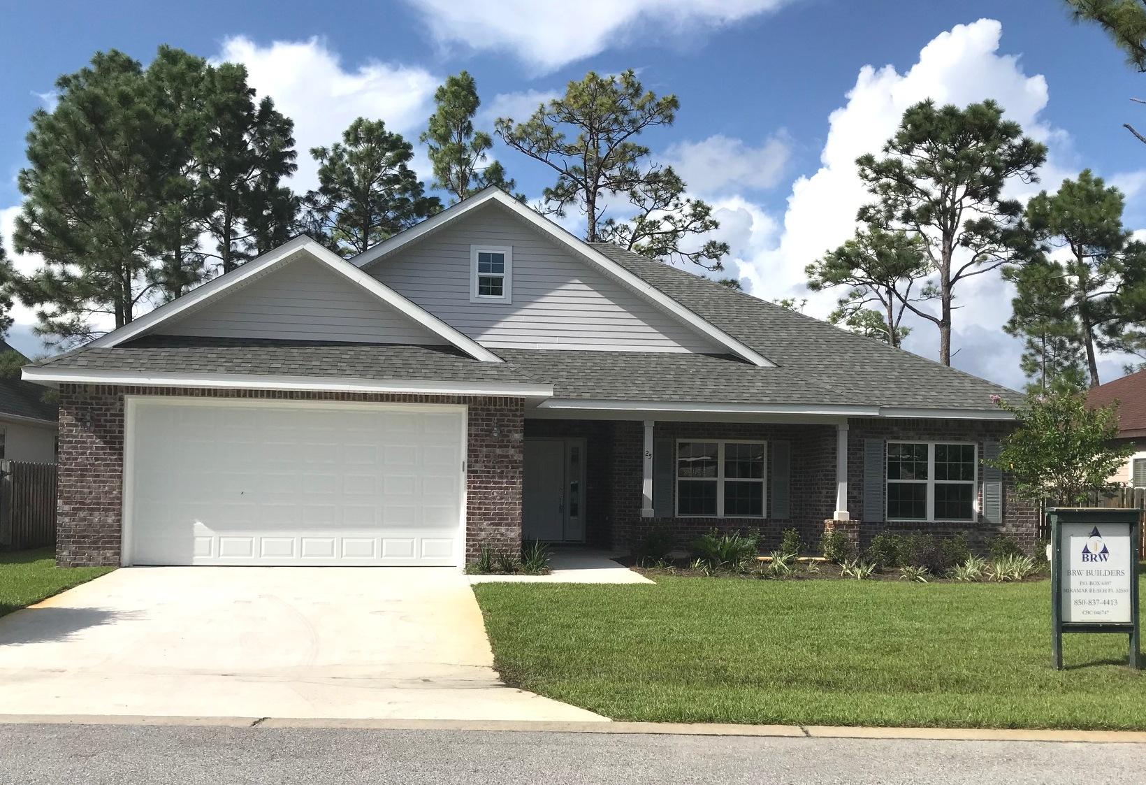 Beautiful quality home by BRW Builders.  Quiet neighborhood that ends in a cul de sac.  Forest Park S/D surrounded by State Forest on south side.  4BR/3BA, Open-concept kitchen and living room with separate dining room. Kitchen features stainless appliances, raised breakfast bar.  Perfect for entertaining.  LVP flooring in common areas and master bedroom. Carpet in the 3 additional bedrooms.  Neutral tones to accommodate your decor and style. Covered back porch. Great location near shopping, local area favorite restaurants, and beaches.