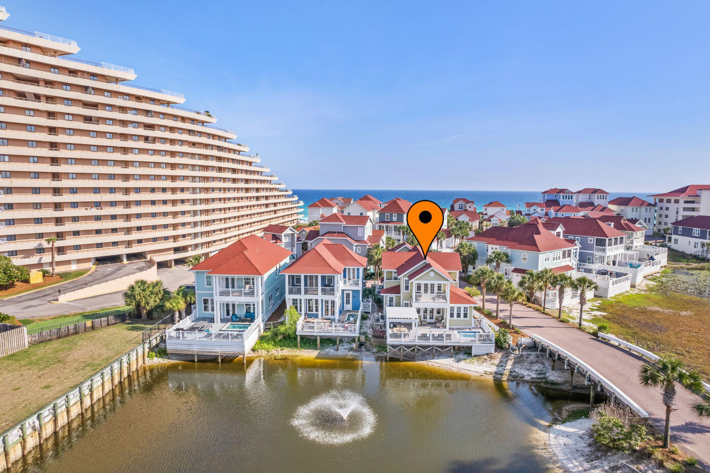 Knot A Care Is A Prefect Coastal Retreat Located In Shipwatch, A Gated Gulf Front Community On The South Side Of Scenic Highway 98.  Just 100 Steps To The Beach, This Fully Furnished 5 Bedroom, 5 Bath Home Is A Great Vacation Rental or Primary/Secondary Home.  Features Include: Updated Bathrooms & Vinyl Flooring, 9' Ceilings, 8' Doors on 1st Floor, Open Kitchen With Breakfast Bar, Granite Countertops & Stainless Appliances. Open Floor Plan With Large Great Room, Dining Room & Sitting Area That Lead Out To The Expansive Outdoor Living Space.  Enjoy The Private Pool & Grill That Overlooks The Lake & Fountain!  First Floor Owners Suite Has Views Of The Lake, Updated Double Vanity With Marble Countertops, Garden Tub, Separate Shower & Walk-In Closet. Additional Owner Suite On The 2nd Floor ==> With Private Porch Over Looking Lake & En-Suite With Marble Countertops. Other Bedrooms Have Slight Gulf Views & All Have Updated En-Suites.  Large 2 Car Attached Garage, Corner Lot, Flood Zone X... So No Flood Insurance Required!   All This Conveniently Located To Best Shopping, Dining & Entertainment Anyone Could Ask For! Call Today For More Details! This Home Can Easily Sleep 15 People & Has Rental Projections Up To $170,000 Annually!