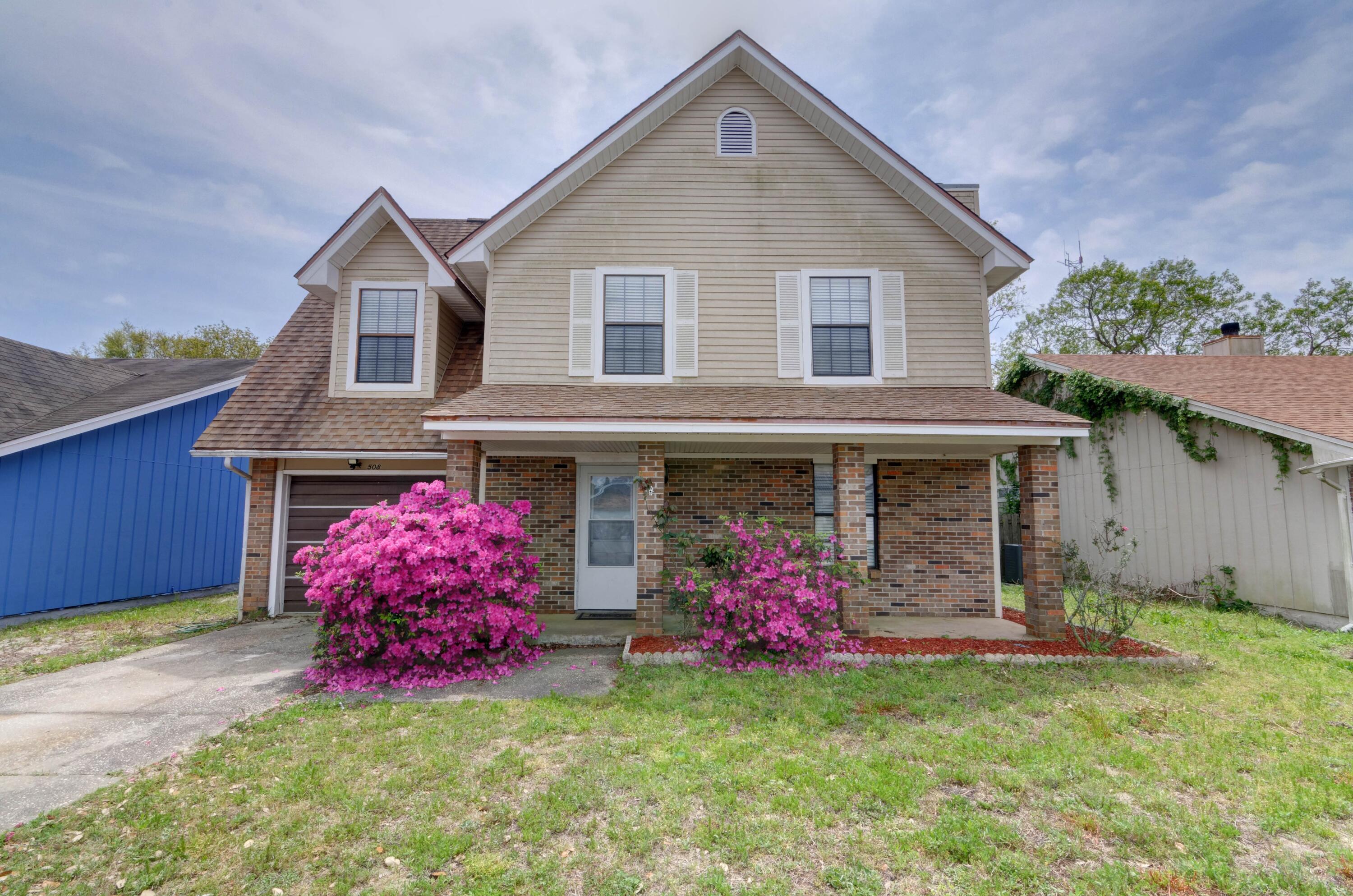 LOCATION LOCATION LOCATION! Only one mile from the front gate of Hurlburt Field this charming two story home is located in the convenient Woodland Park Estates subdivision. Drive up and the gorgeous blooming azaleas will greet you as you make your way to the covered front patio. The first story features a large living room with a half bathroom and storage closet with laminate flooring and a brick wood burning fireplace. The dining area and kitchen lead to the private and completely fenced in backyard. Upstairs you'll find a spacious master bedroom and bathroom completed with two separate sinks, a garden tub, and a walk in shower. The other two nice sized bedrooms also have ample closet space and share an additional full bath. A park featuring basketball courts, playground equipment, and outdoor fitness equipment are also walking distance from home. Don't miss out on this fantastic location!