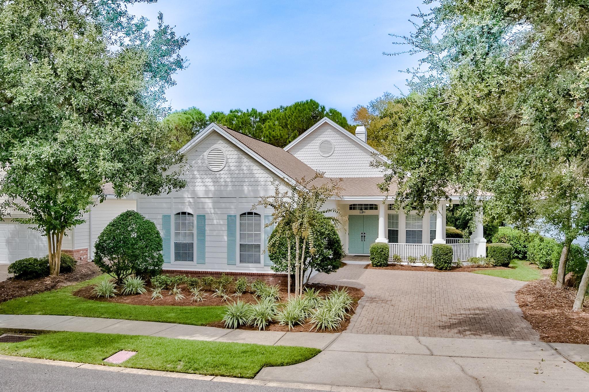 Living is easy in this charming residence nestled upon a tranquil street within the Club Commons neighborhood of Kelly Plantation. Move in ready! Sellers replaced HVAC system in 2018 and hot water heater in 2019. New interior and exterior paint in 2019 embraces the coastal lifestyle with its serene color palette. Sellers have LOMA letter. No flood insurance required. This home will welcome you in with its delightful front porch, just perfect for relaxing with nature. The functional, open floor plan complete with a fireplace and cozy window seat offers an inviting space for entertaining your guests or everyday living. Stackable, sliding glass doors open up to a screened porch where you can let the outside in and admire the peaceful views of the nature preserve for maximum privacy. Of the three generously sized bedrooms, two are master suites each with an en suite bathroom boasting double vanities, tiled walk-in shower, water closet and walk-in closet. Noted features include stainless steel appliances, granite countertops in kitchen and bathrooms, crown molding, raised ceilings, 20" porcelain tile floors, large closets with lots of storage space and an oversized two car garage. Situated in a prime location just steps from the golf club, owner's club, community pool, fitness center and tennis courts. Convenient access to both the front and back gates, puts you within minutes of shopping, restaurants, entertainment, Mid-Bay Bridge and beaches.