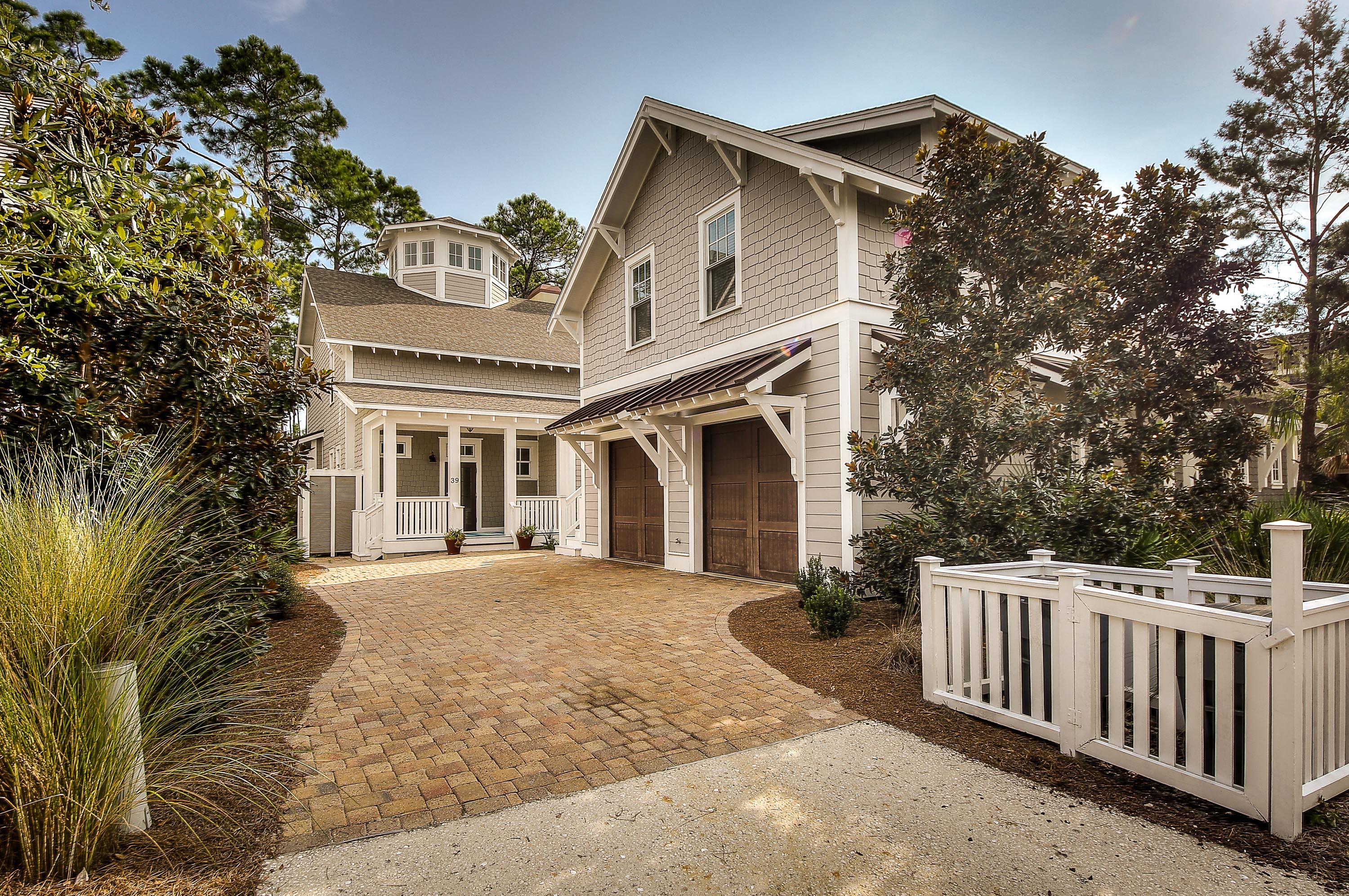 Opportunities abound with this classic WaterSound Beach home. This refined residence, located on a tree-filled lot backing to the Yacht Pond, welcomes you with natural light and gracious screened porches on the first two floors. The main home features four bedrooms, as well as space for a private bunk room, home office or library. The floorplan of the home allows for entertaining spaces on both the first and the second floor. The third floor features a generous octagonal shaped tower, reminiscent of the lighthouses of yesteryear. This private tower also features Gulf views, a perfect respite for serene sunsets. The two-car garage with carriage home allows guests to enjoy their own privacy, thoughtfully created with barn doors separating the spaces. See this beautiful home today!