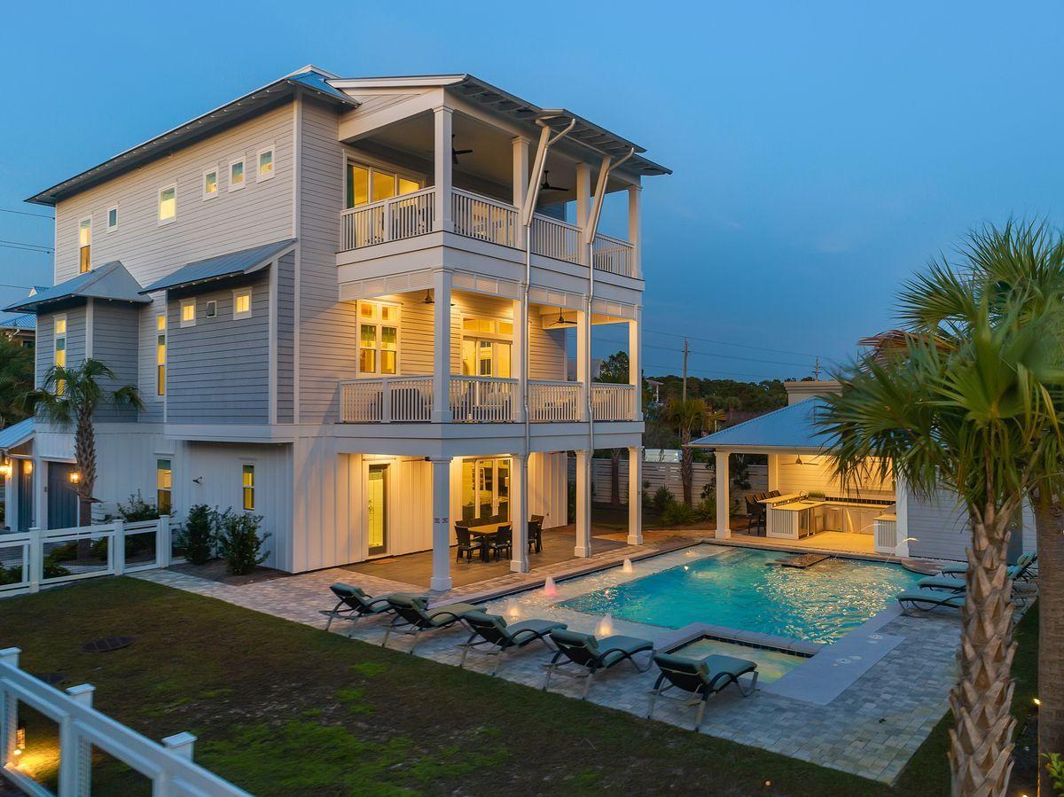 Masterfully built and thoughtfully designed, this exemplary new construction built by Betterbuilt of Northwest Florida is prominently situated on the west end of 30A and presides over an impressive elevation yielding unparalleled panoramic gulf and sunset views from the beautiful top floor open deck. Professionally rendered with coastal contemporary decor, this home was built as a legacy property, perfect for multi-generational living or as a top producing short term rental ($200K-$250K+ annual projected income) offering optimal accessibility from the private elevator which accesses all four levels as well as ample indoor and outdoor living spaces. Notable features include a beautiful outdoor oasis complete with a massive south-facing  pool featuring built-in benches & dining table, covered outdoor kitchen and adjoining lanai as well as an oversized garage which offers private storage for vehicles including a golf cart and beach gear. "Family Traditions" combines open floorplan living with private suite bedrooms generously yielding 5 king suites with spa-like en-suite bathrooms and two guest bedrooms each with a private bathroom.  The first floor, with access to the pool area, is complete with additional living space, bunk room, full bath, wet bar and game room for family to enjoy. The inverted layout plan offers expansive living, dining and kitchen that anchor the second level presiding over views of the pool and characterized by 12' ceilings accentuated by pecky cypress wood detail and a beautiful coastal trim application. The kitchen is fully stocked and finely appointed featuring professional series Thermador appliances, dual dishwashers, ample cabinet storage as well as an oversized center island; perfect for family gatherings. The third level offers dual master bedroom suites as well as a secondary living space with direct access to be heated and cooled fourth level which features an exemplary wet bar with direct access to the open rooftop deck designed to be a gather spot to take full advantage of southwest gulf views and premium sunset vistas. 

3959 W Co Highway 30A is perfectly situated between two gorgeous beach access points including the expansive Old Florida Beach county access with showers and bathroom facilities. This property is within walking distance of exceptional shopping and dining including the shops of Gulf Place, Shunk Gulley and a short drive or bike ride to Grayton Beach and Seaside.