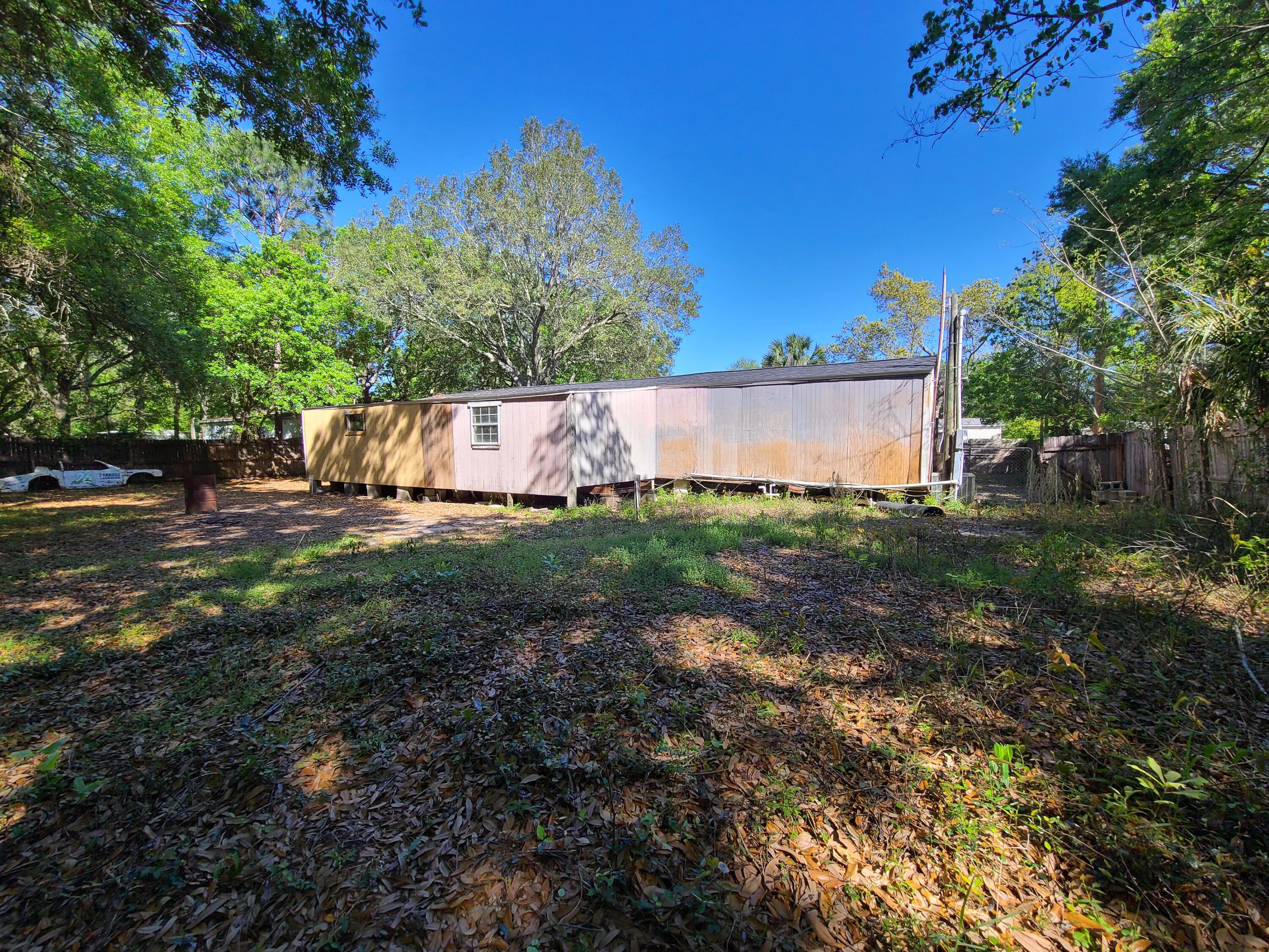 Most of the big ticket items are already done! Just finish up this project home and have the perfect quiet 3 bed 1 bath spot in Navarre close to the beach! 

* New Roof
* Two new decks
* Privacy fence
* Gated driveway
* Open storage area in the back
* Beautiful Palm Tree in the front