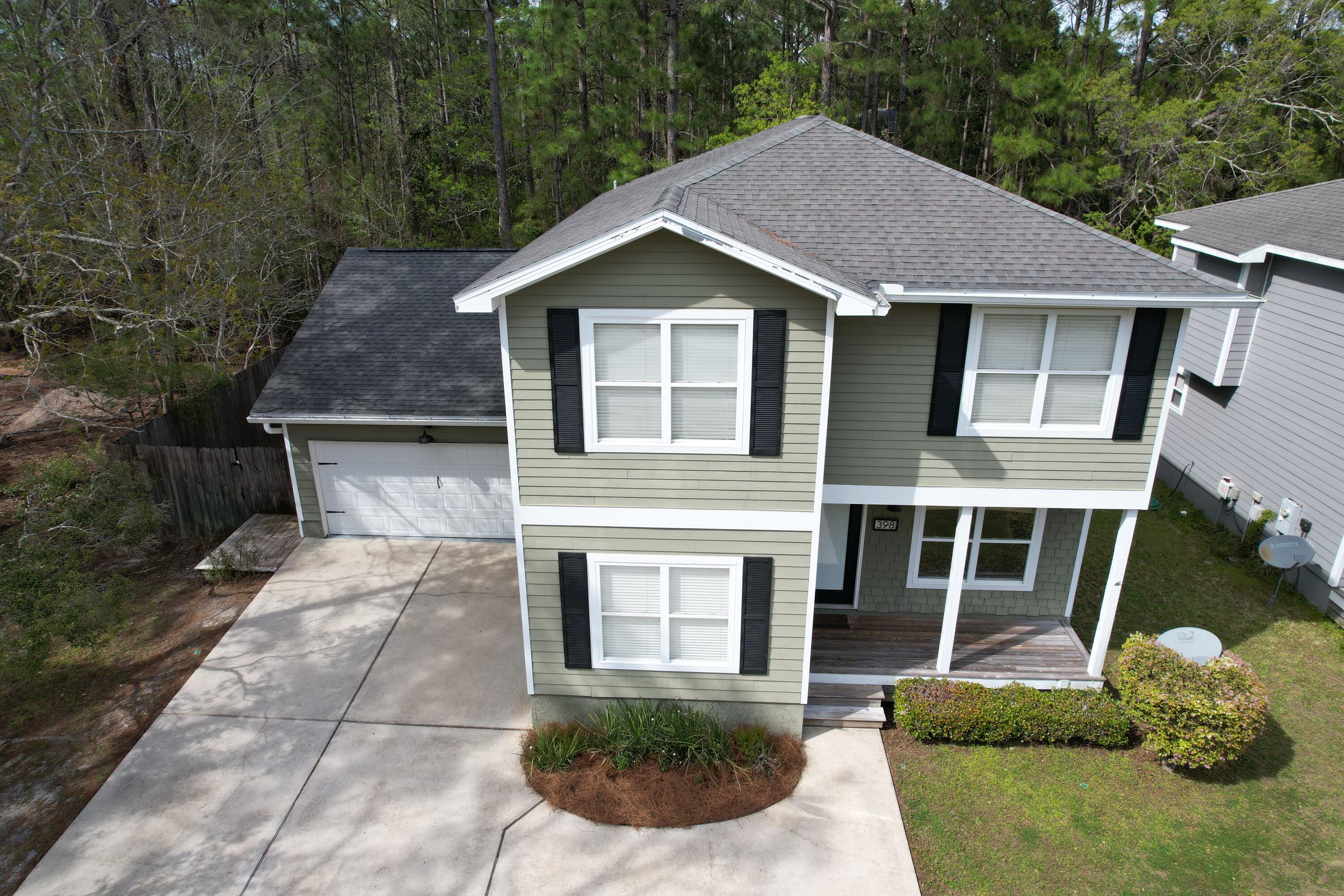 Spacious house with 3 bedrooms, 2.5 baths, quiet area of Santa Rosa Beach north of Hwy 98, features hardwood flooring in main areas, new carpet in bedrooms, large kitchen with oversized pantry and large island.  Extra large screened back porch is great for entertaining, opening to back yard with privacy fence.  Office/workshop/hobby room off garage with separate entrance access.  Second level features large master suite with master bath having 3.5'X6.5 walk-in shower with bench, large walk-in closet, plus guest bedroom with full bath, & Bonus Room (can be used for 4th BR, office, den), tankless water heater, irrigation system, outdoor shower, security system.  Nearby on North 393 is Cessna Park with playground, picnic area and boat launch. 393 South to  beach. Selling AS-IS. NO HOA FEES.