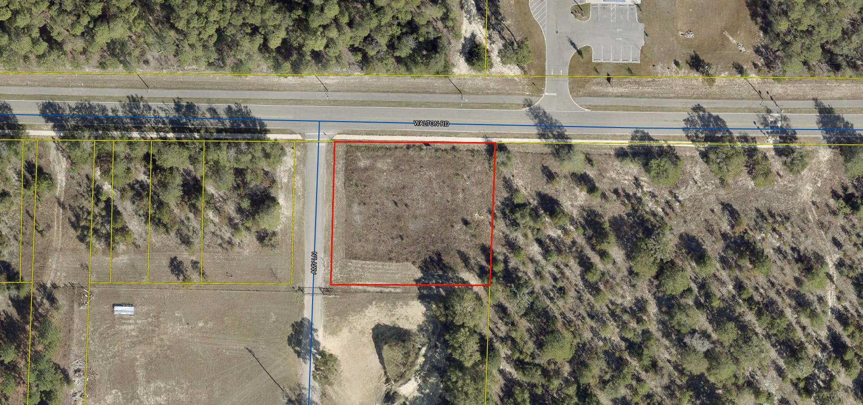 Opportunity to own 1/2 acre of prime C1 commercial land in the heart of DeFuniak Springs' newest growth corridor. Situated directly across from the new School District Office, this lot is perfectly situated to capture daily traffic from district employees, parents, and the surrounding new residential developments. Utilities are readily accessible and lot is ready to build on.   Would make an ideal location for retail, office space, or daycare. Potential to rezone to R2 for multi family dwelling use. (Must confirm with city.) This parcel requires the least upfront cost to build out compared to the other available properties on the market today. Come take a look and see if this is property/opportunity you have been looking for.