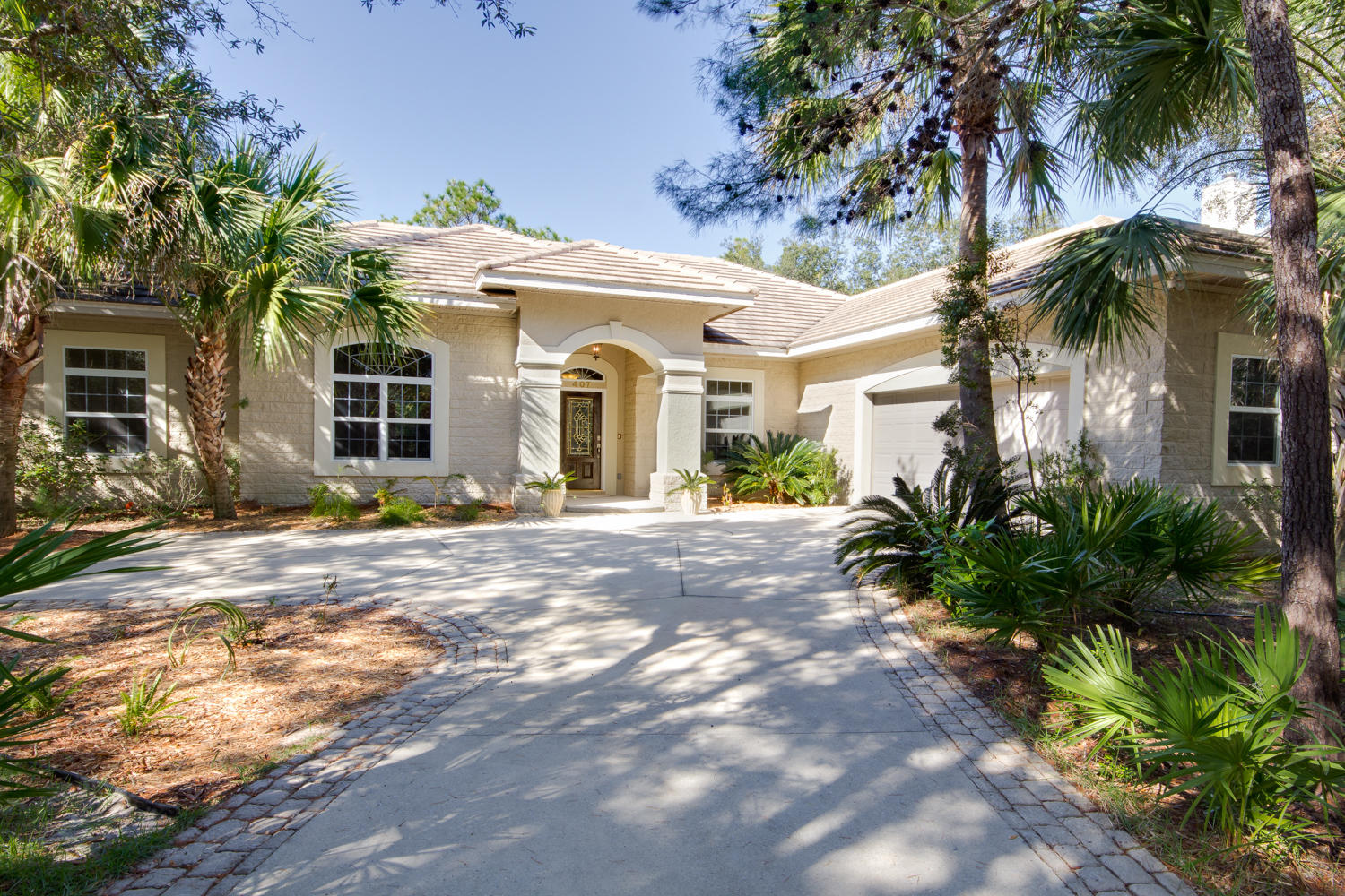 This custom built home is located in Botany Bay a prestigious waterfront community. Complete privacy & tranquility with flourishing native landscaping and state nature preserve. Across the street from public boat/paddle board access dock. This 3 bedroom/3 bath home is built with arched architecture with columns, trey ceilings and recessed lighting. It has a hurricane resistant stone bearing wall and tile roof construction. The entire interior was just painted. It has a custom gas fireplace in the living room and master bedroom. There is surround sound speakers in the living room and master bedroom. The master bathroom shower has tile and glass blocks. The new A.C. unit was installed. Double fenced backyard with large custom private pool with a new screened lanai. Neighboring amenities include community pool, hiking trails, and fishing. Convenient to beautiful 30A beaches, golf, Scared Hospital, Grand Boulevard & Baytown Wharf.