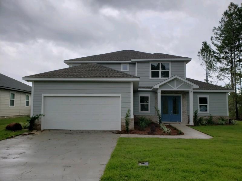Custom built New home located in the beautiful Hammock Bay Community. Home has open floor plan with lots of upgrades: 10' and 11' Ceilings, 22' Living Room Ceiling, Interior Brick Accent Wall, Barn Door to Master Suite, V-groove Kitchen Island, Marble Back Splash, Granite Countertops, All Led Lighting, Master Ceiling Accent Lighting, and Full Kitchen Appliance Package. Home has 4 Bedrooms with 3.5 Baths. The Master Suite is located on the First Floor with Private Shower, Soaking Tub, 7' Double Vanity, and Custom Framed Mirror. The Home also has a second Master Suite located on the 2nd Floor with Private Bath and overlooks the lake. Lots of Extra Storage with Walk-In Pantry, Large Laundry Room, Under Stair Closet, Attic Storage in Garage, and Linen Closets.