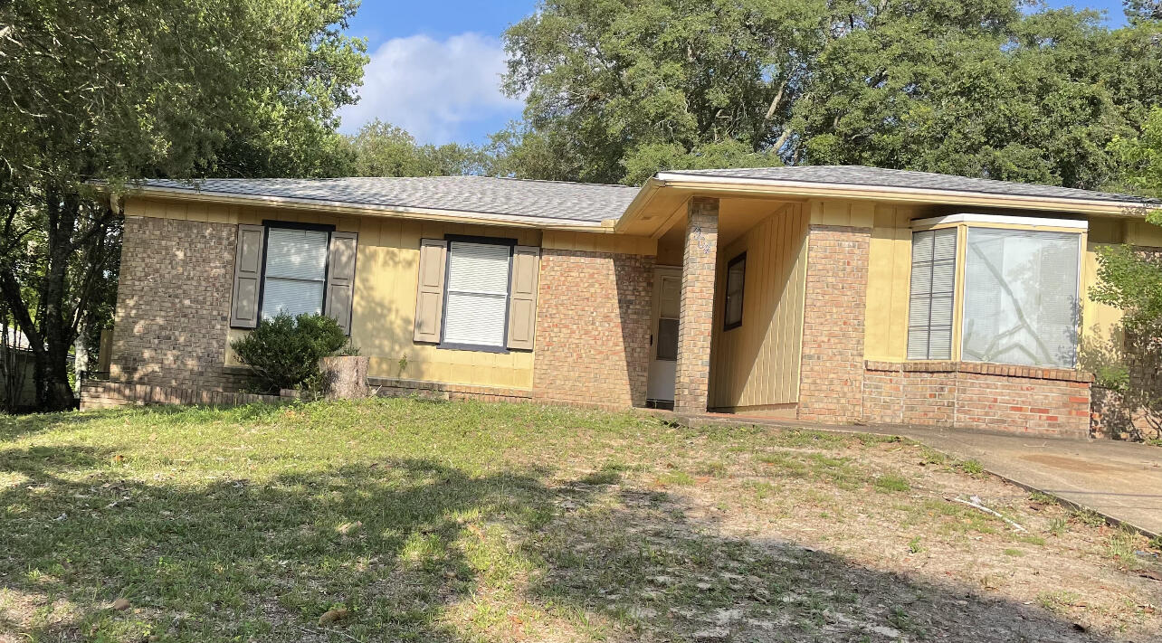 This 3 bedroom 2 bath home is waiting for you.  Close to the high school. Newly painted and new flooring adds to the charm of this ranch style home.  As you enter the home you will notice a very large living area with plenty of room for oversized furniture.  Kitchen has plenty of cabinets, a pantry for storage, and a pass through window for you convenience.  You will find a handy breakfast nook attached to the kitchen. Screened in back porch for entertaining your family or friends.