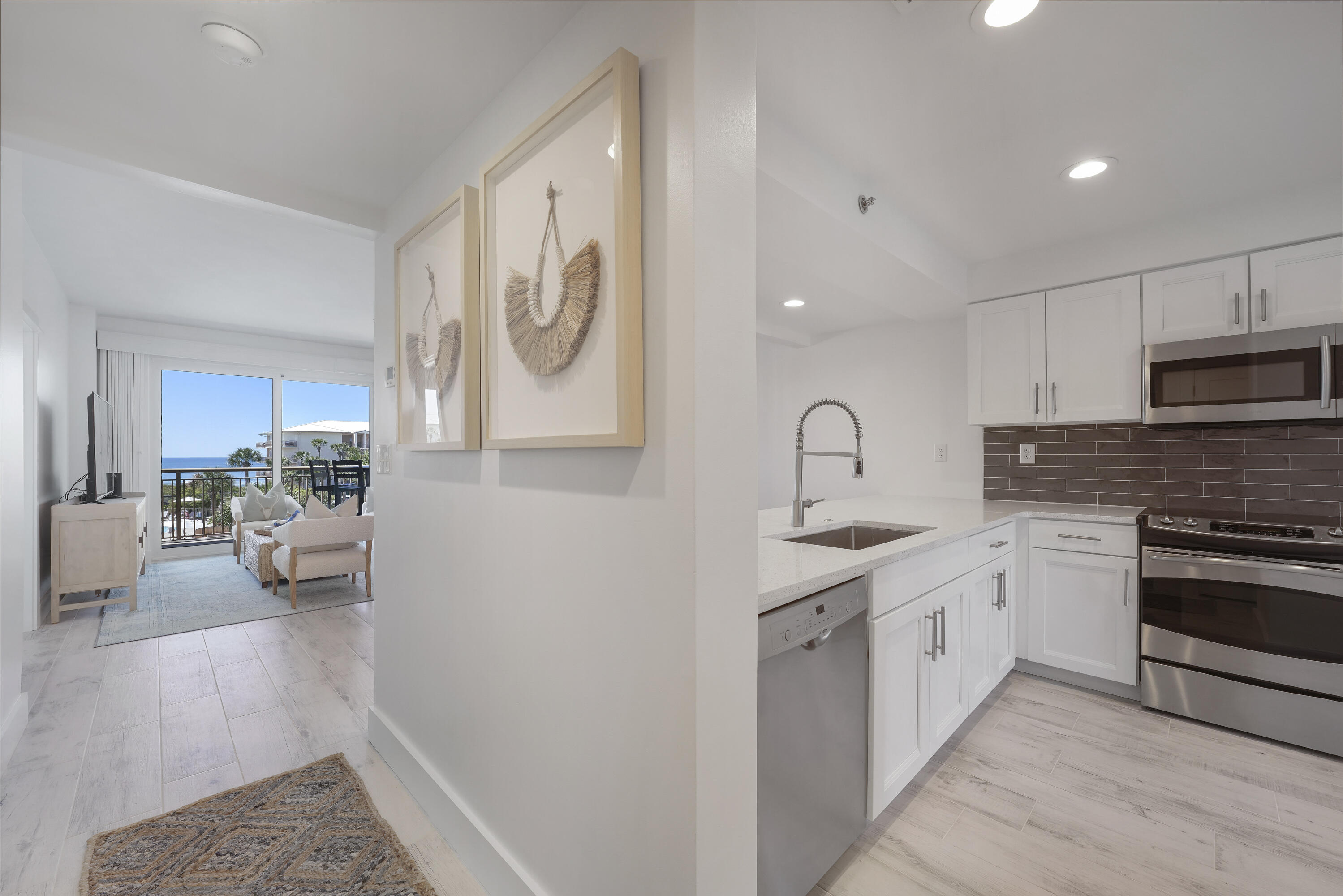 Remodeled and renovated in 2022, this classy 2-bedroom beach condo delivers spectacular unobstructed direct views of the Gulf of Mexico from the master bedroom, living room, dining room, and kitchen.  Plus, you get to enjoy your own private beach in a premier location conveniently tucked between Alys Beach and Rosemary Beach. The owners have carefully crafted this remodel with the astute 30A buyer in mind, with updates that include wood-look tile floors, new sliding glass storm doors, new vanities and light fixtures, recessed lighting, quartz countertops, and new coastal decor and furniture designed by Marisol Guillo. All you have to do is walk in, kick off your shoes and start living the beach life, as this condo is being sold fully furnished and rental read. High Pointe is the hidden gem of 30A, with an on-site gulf front restaurant, beach boardwalks, a lagoon pool, lush tropical landscaping, and a gated entry with security.