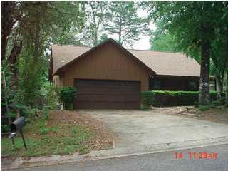 This home has just had a facelift! New kitchen cabinets, counter tops & plank vinyl flooring. Stove/Oven, refrigerator (not warranted) and dishwasher included.  New carpet in living room and bedrooms! This home offers a spacious living room with cathedral ceilings and stately brick fireplace. Large master suite with view to backyard offers plenty of privacy. Fenced in back yard and large deck to add to the extra outdoor living space. There is also a two car garage with plenty of space for additional storage. There is even an indoor laundry room. Sorry no pets allowed. NO Smoking! Any person 18 years old or older must complete separate applications. Tenants required to carry renter's liability insurance while occupying the home.