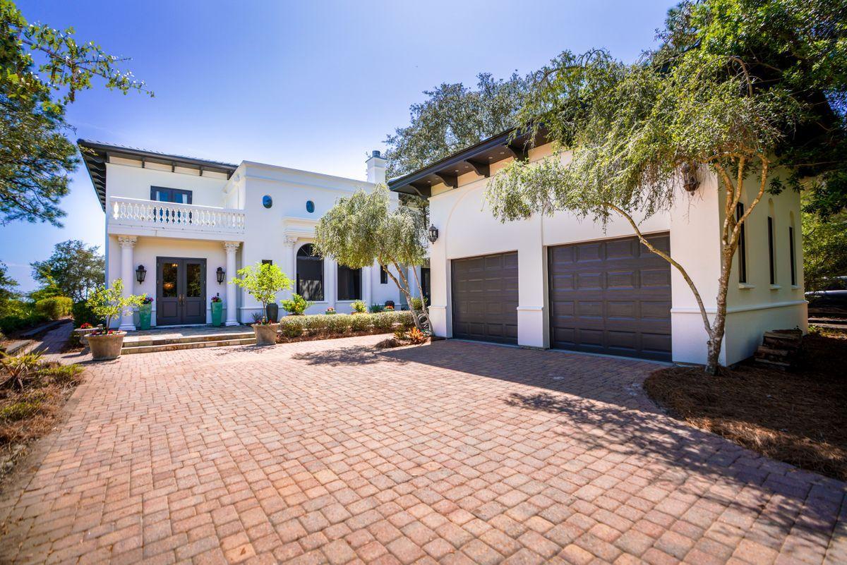 Just imagine the peaceful ambience offered at this secluded private retreat in a gated community, at one with its natural surroundings. It delivers a sheltered and harmonious environment for enjoying the unsurpassed lake and gulf views. The bespoke home has distinctly Italianate features along with a two-car garage separated from the main house by a courtyard breezeway. Wake up each morning to far-reaching views down the whole length of Western Lake from the second floor master with its own sitting area and sun deck. Custom interiors include a lavish fireplace, decorative columns and Terrazzo flooring throughout a plethora of living spaces. The master baths are a temple of pampering with a freestanding ovoid tub and steam shower in one and a soaking corner tub in another. Lake views from M ain floor guest suite and Lake and Gulf views from 2nd floor guest room. All bedrooms have walk out patios! A generous chef's kitchen, complete with Miele appliances awaits your next gathering with family and friends. Stroll down to the private pier for sunset drinks, fishing, kayaking and watersports with access to the gulf and white sandy beaches. The community pool will cool off your hot summer days, just steps away. Enjoy all shops and restaurants in Grayton Beach with a short walk or bike ride, along with a bike path on 30A to all that our beautiful Emerald Coast of 30A has to offer.