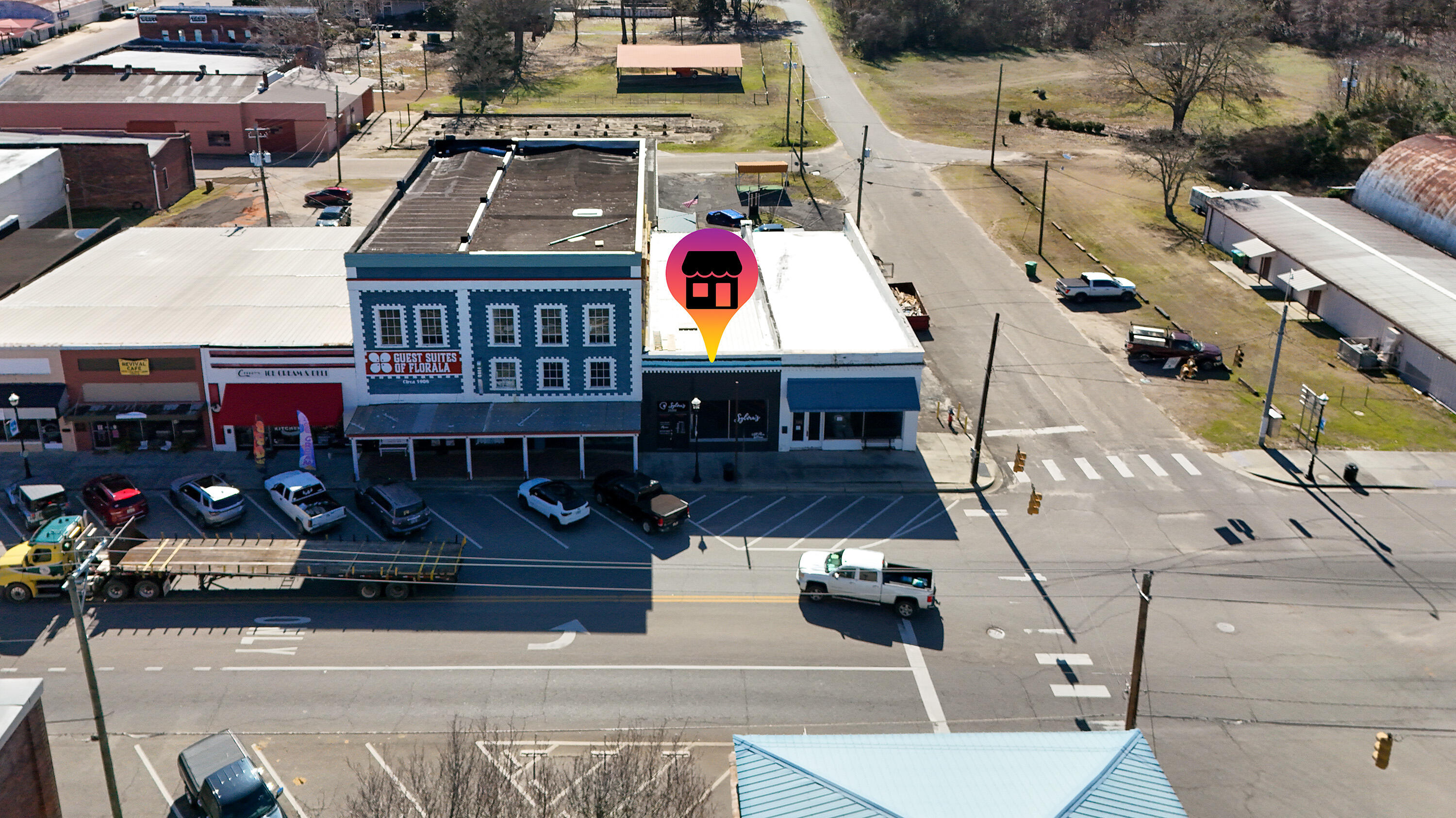 LOCATION- just 1 building over from the main intersection of 331 and Hwy 55 in Florala this 2000 sqft building welcomes all the Beach traffic and visitors coming into town! Remodeled in 2021 this space was turned into an Air BNB for many years. Commercial building offers a large open front office space, a full bathroom, amazing personal offices in the rear of building as well. Property offers a great open floor space for retail while the rear of the building is immaculate! Exposed brick walls, fireplace, and hard wood floors add to the amazing remodel! The exterior of the building offers a great patio area as well as an outdoor shower from previous use as an Air BNB! The protentional in this commercial space is endless! Call today to see this - live in the back and work from the front!