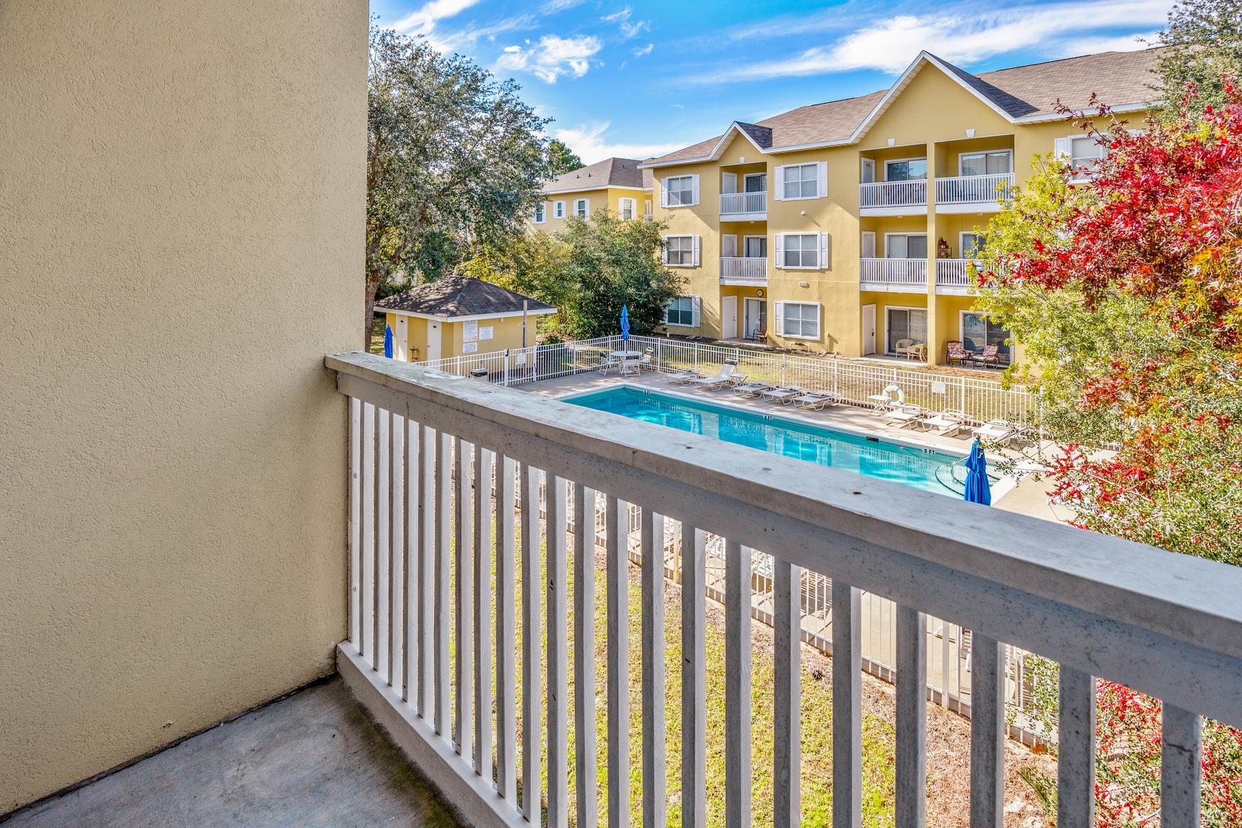Currently the only unit on the market at Heron's Watch condominiums, this well-positioned second floor unit is well maintained. The two bedroom, two bathroom end unit location has extra windows allowing more natural daylight to brighten the rooms. Neutral flooring throughout the living, dining and bedrooms while the bathrooms and kitchen have tile floors. Black granite countertops and appliances complement the kitchen which has a full range of wood cabinets for storage. Just beyond the living area is a private balcony overlooking the pool with an outside storage closet. Herons Watch amenities include a community pool, grilling area, as well as dedicated access to Eastern Lake and community dock, ideal for launching kayaks or paddle boards.  Herons Watch backs up to Point Washington State Park where you can enjoy endless trails for running, hiking and birdwatching. Just down the road, the planned communities of Seagrove Beach, Seaside and Alys Beach provide a variety of dining and entertainment for those who want to enjoy fun-filled days from their new beach hideaway.