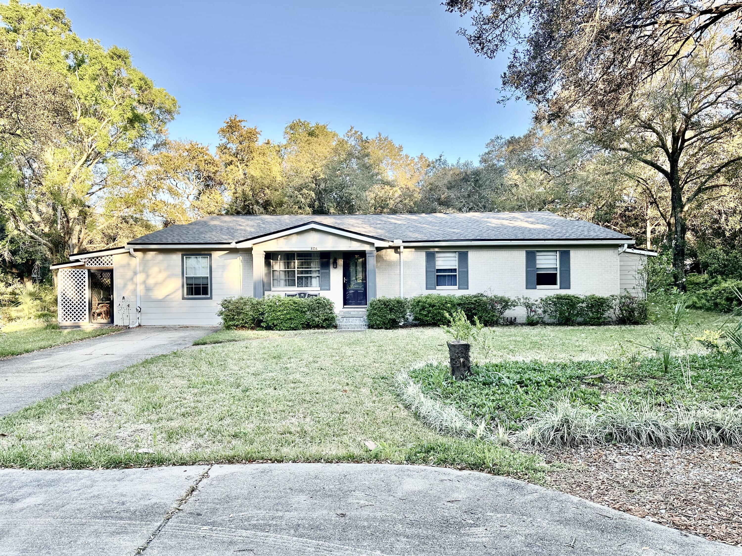 SELLER IS OFFERING A $5,000. CREDIT TO BUYER AT CLOSING FOR ANY WANTED HOME IMPROVEMENTS! This is a rare find in the highly sought after Moreno Acres Subdivision. What makes this area so desirable is there is no HOA and almost every home sits on a very large half to an acre size lot so you're not right on top of your neighbors. The neighborhood also includes two city parks with water access on Joes Bayou so bring your fishing poles and paddle boards and head out to Crab Island anytime. When you arrive at 808 Harbor Lane you will notice not only the ample parking but the gorgeous landscaped yard with beautiful seasonal greenery inviting you in. This brick ranch style home has been well maintained and upgraded. There are three bedrooms and two full baths in the front of the house and an addition of two bedrooms, full bath, and large living area/bonus room added on the back with a private entrance. There is also a screened in sunroom to enjoy the outdoors without the bugs and on the other side of the house are two catios for the fur babies but they could easily be converted to screened patios. A huge backyard awaits with shade trees and privacy with plenty of room for a pool and  guesthouse. All necessary wiring replaced, tankless water heater added and a new roof recently installed in 2022. Gorgeous granite countertops in the kitchen with newer LG appliances including a double oven for those large family gatherings. All rooms including kitchen cabinets have been freshly painted to look brand new. This home has been well loved and taken care of by the owner and resident of thirty plus years so come see it today and explore the neighborhood parks while you're here. The dolphins are always playing in the bayou and are a must see along with all the other wildlife.