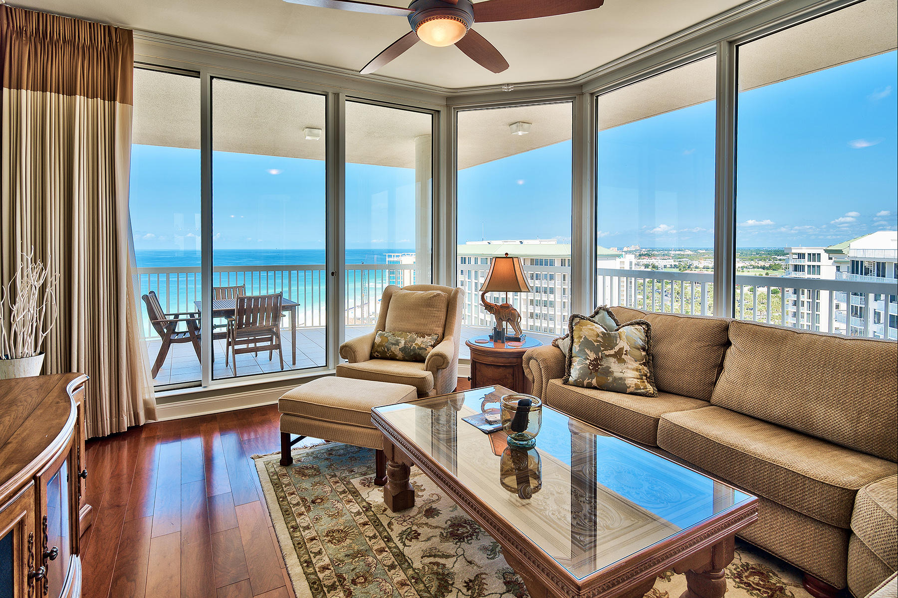 This lofty corner penthouse presides over mesmerizing Gulf and beach views to both east and west as far as the eye can see. Check out the exclusive penthouse video tour! Located within the exclusive St Thomas condominium building, which is non-rental, this 3,200 sq.ft home surrounds you with luxury, starting the moment you step through the double mahogany and glass entrance doors accessed by private elevator. Gleaming wood floors and a feature chandelier create an opulent ambience. The spacious living room and formal dining area enjoy multiple aspects of the beach, pool and stunning Emerald coastline while three bedrooms and 4.5 baths provide ample space for family and guests to share this dream Gulf front residence. The Master Suite is naturally the grandest of all, with a sitting area for enjoying panoramic views, his-and-hers closets and full marble baths. Beyond the full-height patio doors, a huge corner balcony sweeps around the condo in a beautiful curve, with space for a BBQ, dining area and more. Views to the east of the property include the protected green space of Henderson Beach State Park which offers ample opportunities for fishing, swimming and wildlife viewing. At ground level, the generous amenities of this penthouse continue with a two-car garage and poolside cabana.