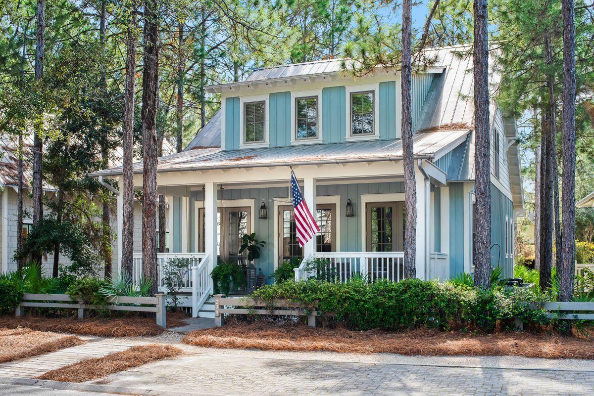 Tucked in Phase II of WaterColor, this bright beach retreat offers tranquil outdoor living spaces and close proximity to community amenities. Well maintained, the home features an open floor plan with inviting living areas, beautiful hardwood and tile flooring throughout, and updated furnishings. A chef's kitchen overlooks the dining area and features granite countertops, stainless steel appliances, a breakfast bar, and white cabinetry with plenty of storage. Ideal as a primary residence, second home, or investment property, this home offers 2,532 square feet of living space, a suite on the main level, two suites upstairs, and hall bunks for additional accommodations. Private outdoor living spaces lend themselves to enjoying each unique season along the coast. Relax and unwind on an expansive covered front porch, screened back porch, or on the private second floor balcony off the master bedroom suite.
 
Behind the home you'll find a walking path that leads you directly to the Camp Watercolor pool. Enjoy easy access to all of WaterColor's many desirable amenities, including tennis courts, pickle ball courts, a fitness center, and the newly-designed WaterColor Beach Club. Explore the nearby Point Washington State Forest or check out the many restaurants and shops along Scenic Highway 30A. Best of all, this coastal retreat is just minutes from beautiful Gulf of Mexico beaches.