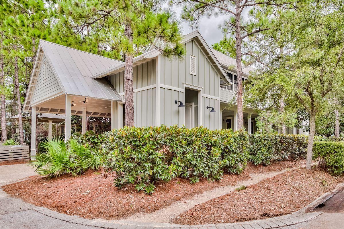 Don't miss this rare opportunity to own a beautiful 4BR Watercolor beach cottage on a gorgeous landscaped corner lot close to Camp Watercolor in one of the most desirable areas in the community. This charming beach cottage has beautiful hard wood floors with 12-14ft ceilings. The first floor has its own master bedroom with shower and separate tub. Also on the first level is the main living area which has an open floor plan with a powder room in the hallway. The first level living space includes a wood burning fireplace, dining and kitchen area and a comfortable living room. The kitchen has all the superior brands including Sub Zero, Wolf and Asko. The second floor has a huge master bedroom suite plus two additional bedrooms. This beach cottage has two large screen porches plus an open side porch to enjoy our beautiful Florida weather. Also, this home comes with excellent parking and storage including a covered 2 car rear loaded carport and a large pavered parking pad.