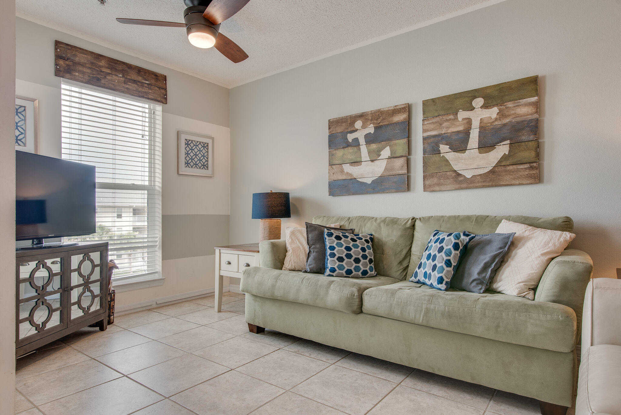 Would you prefer to lay out on the crystal white sand beaches of the Gulf or paddle board on the calm waters of the Santa Rosa Sound? Luckily with this Unit, you can have both.
This incredible unit is located between the Santa Rosa Sound and the Gulf of Mexico, within walking distance to both beautiful bodies of water. Take a dip in the community pool or take a walk to the Navarre Beach Pier.
This stunning unit sleeps 6 and boasts a full beach theme look, tile floor, in unit washer and dryer, and an open floor concept. The Kitchen backsplash and new recessed lighting adds to the beachy theme the unit presents.