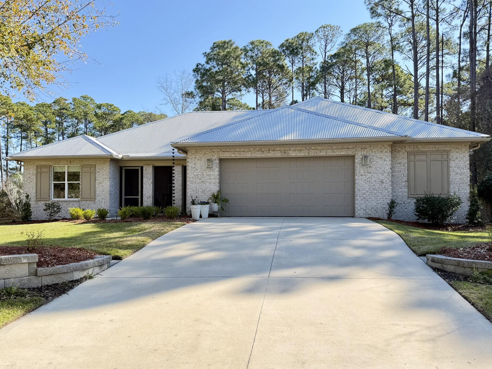 Exquisite 3BR/2BA Randy Wise custom built home - No HOA! Catch glimpses of the bay from this all brick residence situated on a private 0.59 acre lot featuring two screened porches. Thoughtfully designed single story split-bedroom floor plan showcases quartz countertops, crown molding, custom shades, and numerous smart upgrades, including a floor outlet in living room, and pre-wiring for security and entertainment, and added electrical outlets in the pantry for enhanced functionality. 
Step into serenity - the primary suite feels like a private spa retreat with heated tile floors, a Kohler soaker tub framed by a picture window and an electric fireplace. The luxurious bath also features a spacious step in shower, water closet, walk-in closet and dedicated laundry access.  Entertain in style in the open-concept kitchen and living area highlighted by a custom-designed built in entertainment center. High-end furnishings from Havertys, Liddon and Coast Furniture further elevate the interior and the home is offered furnished for a fully turnkey opportunity. 

The oversized 2.5-car garage features a dedicated workspace area and pull-down stairs leading to a welll-lit attic with flooring, and shelving fpr additional storage. 

Outdoors, the expansive back yard backs to a conservation easement and has been thoughtfully enhanced with fresh topsoil, new sod, and professionally updated landscaping with all new plants. Newly added pavers accentuate the backyard gathering space and complement the lighted water fountain, bistro lighting, 3 person hot tub, and citrus trees - creating a private oasis ideal for relaxing or entertaining.

For added peace of mind, the home includes transferable termite. A recent survey and environmental study are available, providing valuable documentation and confidence for prospective buyers.

This exceptional property is available only due to a job relocation, presenting a rare opportunity to own a meticulously upgraded, beautifully maintained home in a highly desirable setting.