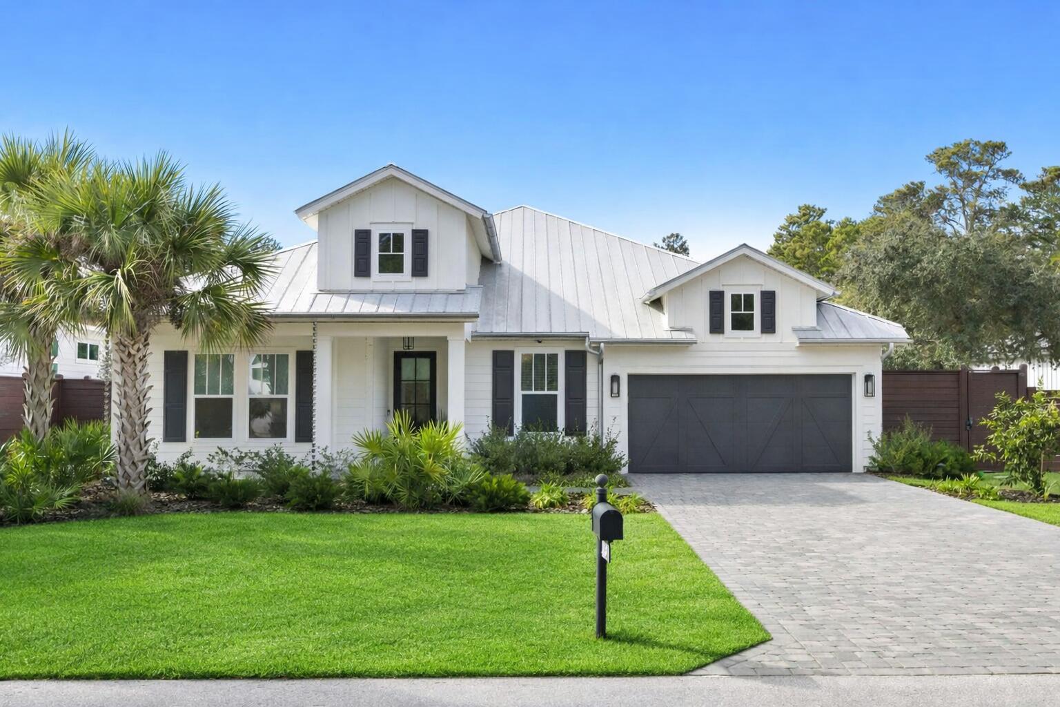 Stunning Seacrest Beach retreat on a quiet dead-end street with no HOA, just a short walk to the beach and in close proximity to Alys Beach, Rosemary Beach, WaterSound Beach Club, and Camp Creek Golf Course. Designed by Bunny Hall of The Perfect Plan and remodeled by Armbruster Construction this 4-bedroom, 4.5-bath home showcases designer lighting by Beautiful Lights, custom tile from Q Tile, custom window treatments by Beach Blinds and offers 2,528 square feet of thoughtfully designed living space with a 2-car garage, a paver driveway, and a large fenced back yard with a private pool. A grand entry welcomes you into an open-concept floor plan showcasing custom designer lighting, tile, and finishes throughout. The living area features a tray coffered ceiling and custom wallpaper, flowing seamlessly into the dining area with a well-appointed dry bar including a large wine refrigerator and ice maker. The chef's kitchen has been fully renovated with marble countertops, a large island, pantry, high-end stainless appliances, gas cooktop, in-wall oven and convection oven, dishwasher, and an oversized single-basin stainless sink, ideal for both everyday living and entertaining. The primary suite overlooks the private pool and fenced backyard and offers a spa-like bathroom with dual vanities, a private water closet, walk-in shower, and walk-in closet. Indoor living extends outdoors to a screened porch with a gas fireplace and summer kitchen, perfect for year-round enjoyment. The spacious backyard includes a salt water pool with waterfall features, chair deck with umbrella designed and installed by Southern Blue, an outdoor shower, and plenty of room to relax or entertain in the large fenced back yard. This property is a must see, call to schedule a showing today.