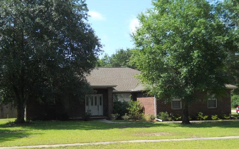This home has many features including a fireplace and tile in the kitchen and both bathrooms & utility room. The kitchen is well-equipped with a smooth-top self-cleaning stove, microwavehood & dishwasher. The livingroom has French doors leading to the large 30X8 covered porch. The Master bath features a garden tub, separate shower & double vanity all in cultured marble. There is also a glass block window over the tub area. The garage is a side-entry. This lovely and well-maintained home sits on a large corner lot and the backyard is all privacy-fenced. Call today!