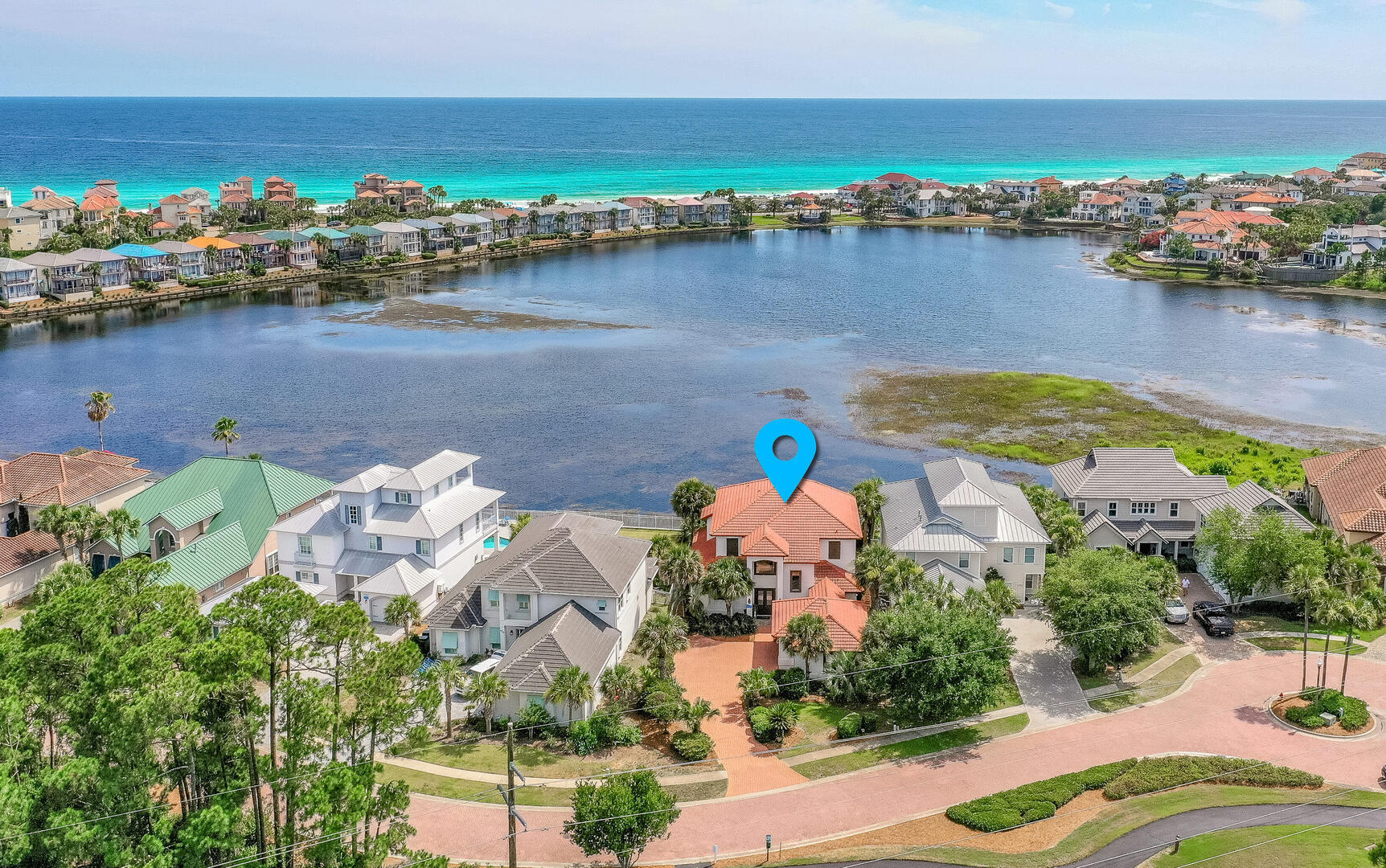 Welcome to 4720 Rendezvous Cove ''Sea of Dreams'' - where elevated coastal living meets serene lakefront tranquility in one of Destin's most coveted gated communities, Destiny East. This recently updated 4-bedroom, 4.5-bath luxury retreat is perfectly positioned on the peaceful shores of Four Prong Lake, offering captivating water views, stunning sunsets, and total privacy. A fantastic rental property with over $100K in base rental income for 2025 is already off to an incredible start for 2026, with over $95k already on the books. Meticulously renovated and professionally furnished, this home blends timeless elegance with fresh, modern flair. From the moment you enter, natural light pours into expansive living spaces, highlighting high-end finishes and thoughtful details throughout. The.. chef's kitchen has been completely upgraded with quartz countertops, a sleek new backsplash, and all-new stainless steel appliances including a refrigerator, oven, dishwasher, and wine cooler making it as functional as it is beautiful. Freshly painted walls, custom trim, and new designer furniture in every room elevate the home's inviting, coastal aesthetic. With two spacious master suites one upstairs and one down plus ensuite bathrooms and walk-in closets for every bedroom, the layout offers luxurious comfort and privacy for family and guests alike. The open-concept floor plan, wide hallways, and generous gathering spaces make entertaining effortless and enjoyable.
Step outside to your private backyard oasis, where a resort-style pool and spa overlook the lake and are equipped with LED lighting, a new gas heater, pump, plaster, tile, and a freshly installed irrigation system and landscape lighting. Whether you're soaking in the spa or lounging poolside under a painted sky, this space is a showstopper complete with sweeping Gulf views from the upstairs balcony. Just a short walk to the beach or a quick ride via golf cart, this location offers unbeatable access to the best of the Emerald Coast. As a resident of Destiny East, you'll also enjoy premium community amenities including a large resort pool, tennis courts, clubhouse, grilling area, and playground - all just minutes from Destin's top dining, shopping, and sugar-white beaches. Don't miss your opportunity to own this extraordinary coastal escape. "Sea of Dreams" is more than a home it's a lifestyle.