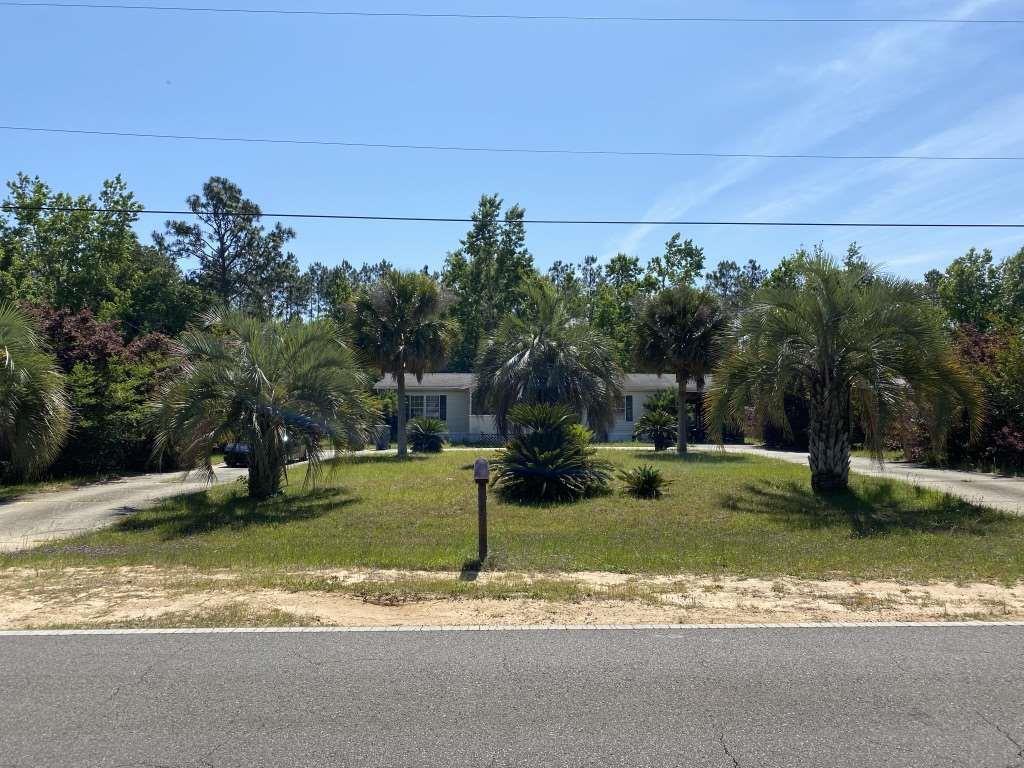 LOCATION, LOCATION, LOCATION AND A PRIVATE POOL!!
Calling all investors!!
This 1997 double wide 3 bed/2 bath Mobile home, with attached carport, has great potential as an investment property or would make an excellent fix and flip! Floors and appliances are newer! Situated on 0.38 acre, it has a screen enclosed, inground pool and backs on to the Blackwater Heritage State Trail with gated access right from your yard. It also has a large, pretty frontage with Palm trees and paved circular drive. Property will require lots of TLC, repairs and updates. There is no working HVAC system and the home is being sold AS-IS, with no repairs.
Please do not disturb Tenants - showings are by appointment only. Contact me or your favorite Realtor today, to schedule.