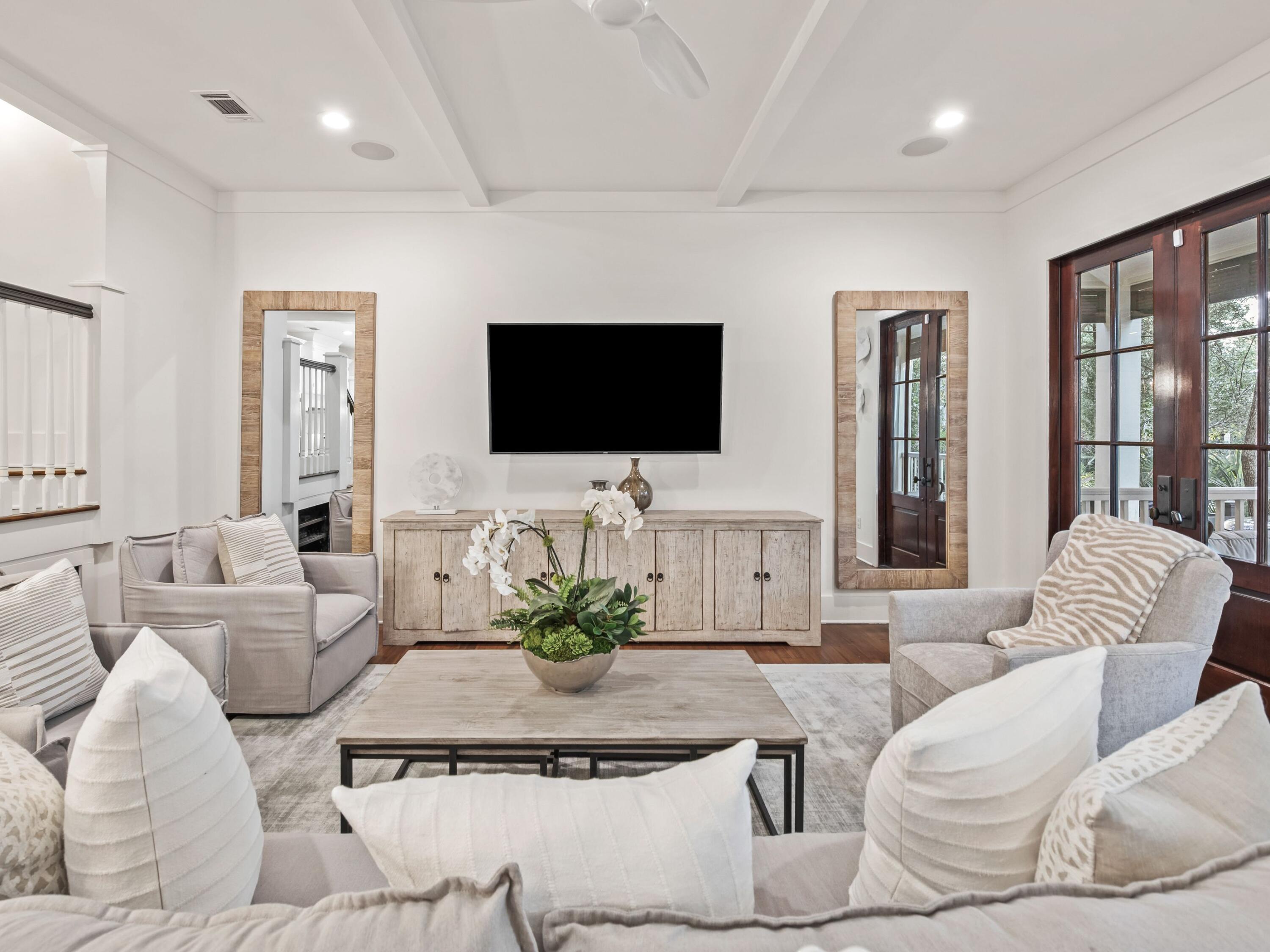 Newly painted and furnished throughout, this desirable custom-built home in WaterColor is tucked away in the leafy Park District on one of the community's most popular streets. From the expansive front porch to the third-floor tower with gulf views, this luxury beach house never skimps on space. Faux shutters, beautiful hardwood floors, wraparound screened porches and partial wainscoting add eye-catching detail. The expansive great room with its soaring beamed ceiling exudes a sense of comfort and well-being with its attractive soft furnishings. The open floor plan extends through the formal dining area to a sunlit kitchen with gorgeous granite countertops. It's designed for entertaining on a grand scale. Take a seat at the center island breakfast bar and chat with the cook while high-end Wolf appliances and a capacious farmhouse sink take care of the hard work. A custom-built office with granite workspace and a master suite with a covered porch round off the ground floor accommodation. Step outside to admire the covered back porch and generous patio space which is perfect for alfresco dining while kids splash in the alluring pool. The second floor is dedicated to an additional living area, a second master suite, a bunk room and two spacious guest suites. The wraparound porch is a quiet area for relaxing on the bench swing or playing ping-pong. Head up to the tower room for the best sunset views through the trees to the glittering Gulf of Mexico. Set on almost 500 acres, WaterColor is arguably the best-planned community in the area. Bicycle trails and boardwalks lead past picturesque homesteads to the beautiful sandy beach and gulf-front pool. The Beach Club is the place for sunset gatherings with friends and enjoying the enviable pool surroundings. Camp WaterColor, a state-of-the-art fitness center, tennis, parks and green spaces make this so much more than a vacation home in a leading resort. Ideal as a permanent residence or lucrative vacation rental investment, the deal is sweetened with more than $240,000 in rental revenue currently on the books.