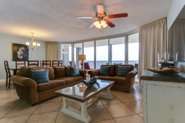 This beautiful 1769 square foot, extensively upgraded, third floor, 3bed/3bath condo is considered by many to be the best floor-plan on the beach! Property enjoys floor-to-ceiling views of the Gulf from all three bedrooms and great room that steps out to one of two large private balconies. Extensively remodeled and meticulously maintained. Conveys fully-furnished, turnkey, and rental ready. Custom tiled floors means easy clean-up and ultra-low maintenance. Granite, shaker cabinets, and Stainless Steel in the kitchen! Both master bedrooms are gulf front and have access to the enormous main balcony. Both also have en suite baths that feature new stained maple cabinets, custom showers, and double vanities. Third bedroom can be converted to a standalone lockout to maximize rental potential
