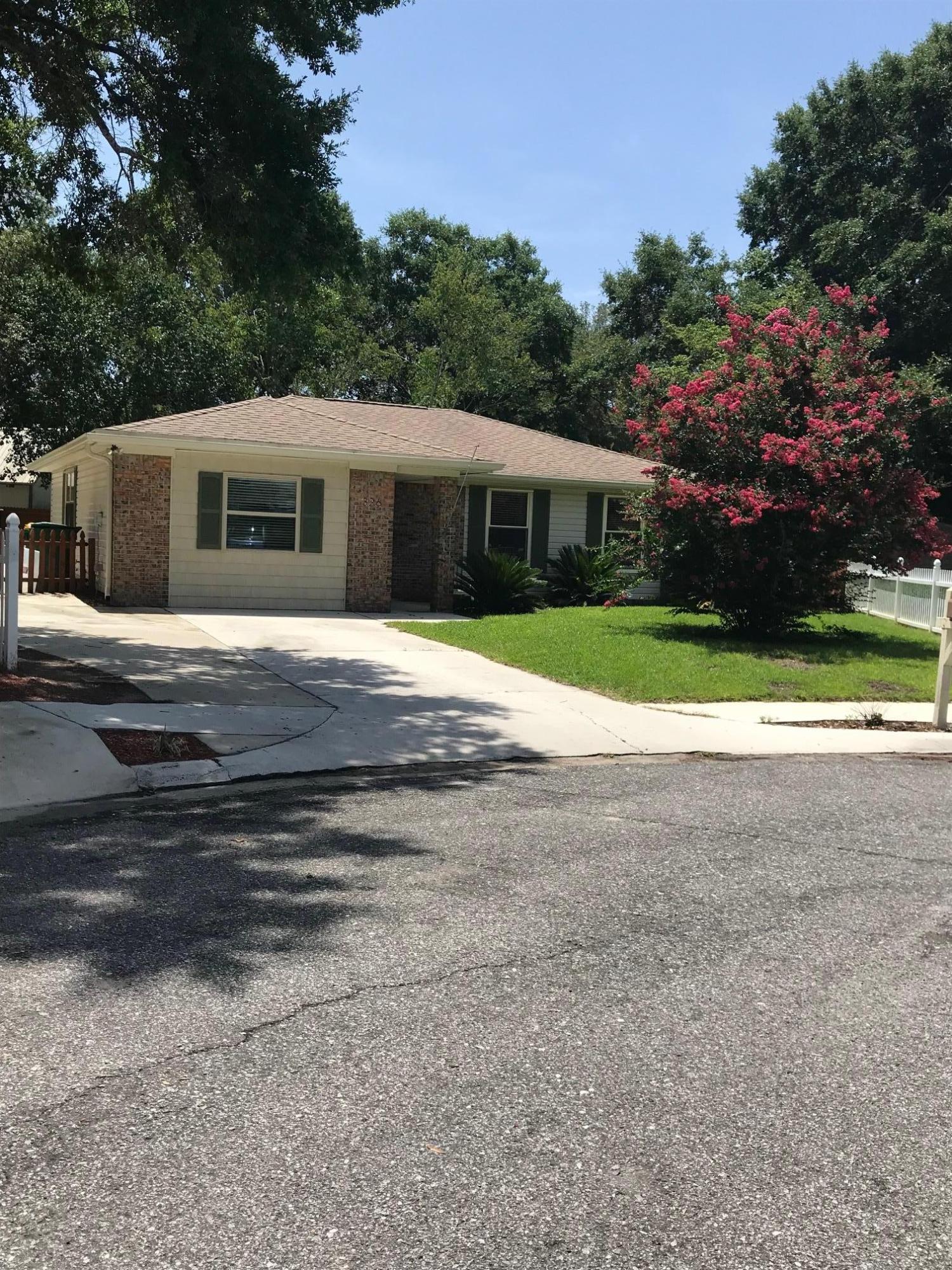 Lovely renovated home on a large lot near the end of a cul-de-sac in the heart of Niceville! Super location with shopping, schools, recreational opportunities and Eglin and other bases close by. With an open floor plan for family fun and entertaining, the kitchen has custom cabinetry and granite countertops, engineered wood flooring in the common areas and tile in others, carpet in the bedrooms and den. The den could be converted easily to a fourth bedroom. Open and bright,the living area opens up through French doors to over 450 square feet of patio and a very large back yard! There are two permanent sheds on concrete slabs in the rear yard, one 15'x15' with electrical service, the other is 15'x12' without electrical. Extra long driveway for multiple cars, an RV or boat, or combination!