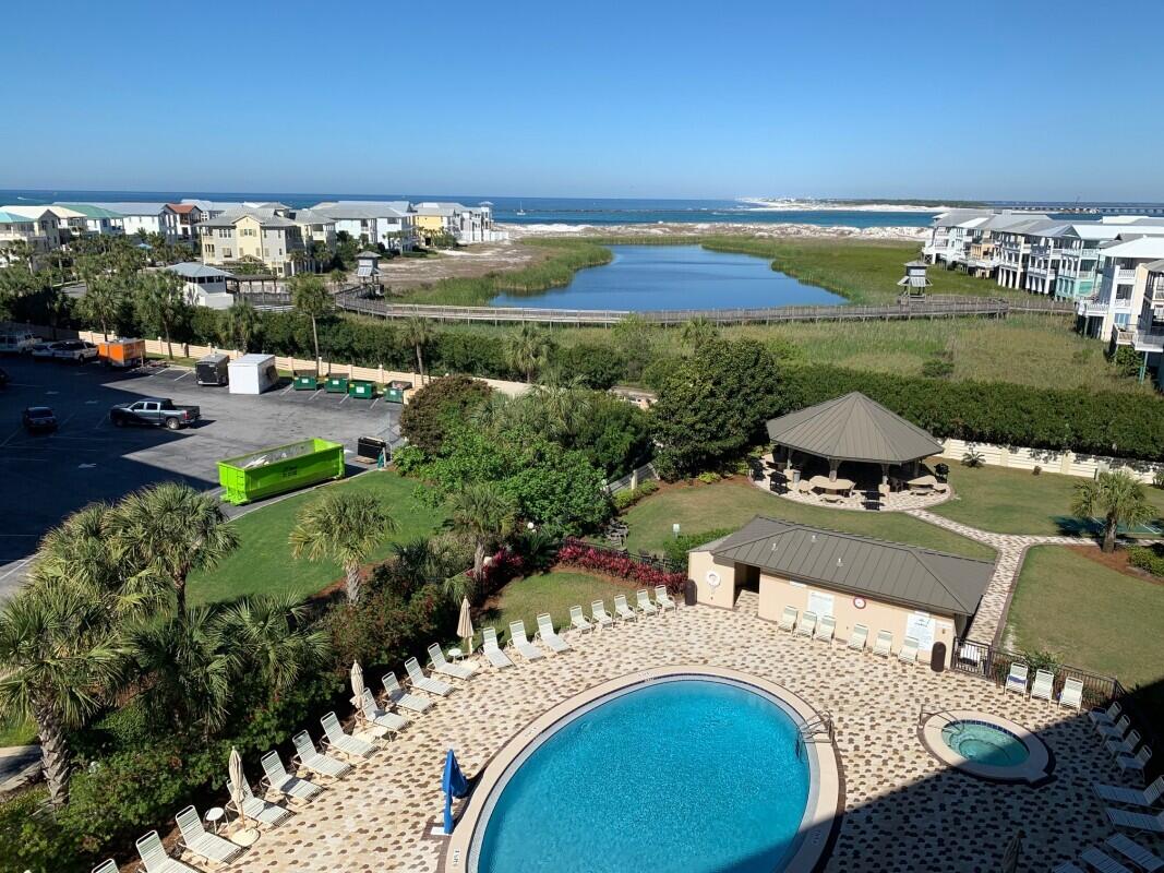 Gorgeous 2 bedroom and 2 bathroom condominium located at the popular Islander! Enjoy beautiful views of Lake Christina and the Destin Pass in which you can enjoy the most stunning sunsets from the balcony. This condo has stainless steel appliances, marble countertops, white cabinets, and wood like flooring! This unit has a seasoned rental history and is turn-key! The Islander has tennis courts, pools, hot tubs, covered BBQ gazebo, exercise room. beautiful lobby, and landscaping throughout the complex! Don't delay and capture your piece of paradise today.