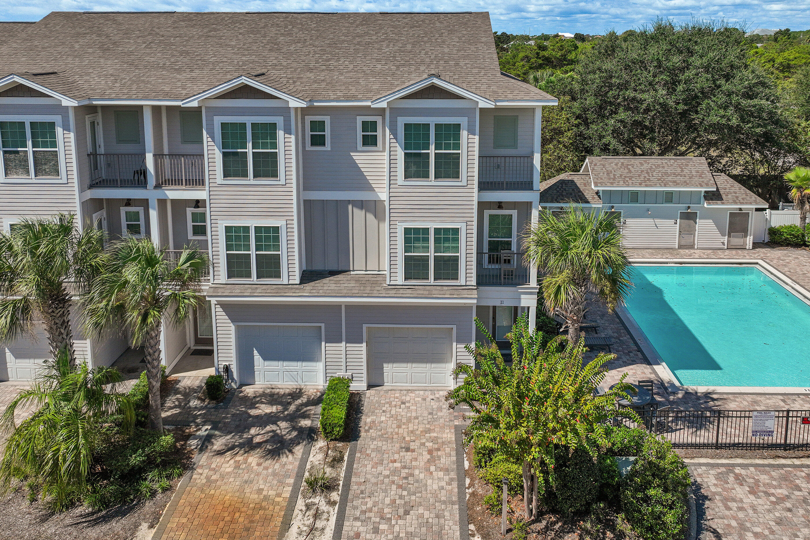 Welcome to 257 Driftwood Road, Unit 11, a stunning three-story townhome nestled in the heart of Miramar Beach, FL. This charming corner unit exudes a cozy and relaxed vibe, offering a comfortable 2,018 square feet of living space with four bedrooms and four bathrooms. 

As you step inside, you'll be greeted by beautiful oak hardwood floors and crown molding, setting the stage for a welcoming atmosphere. The spacious and airy living area flows seamlessly into the dining room and kitchen, outfitted with sleek stainless steel appliances, including a dishwasher and microwave. Enjoy casual meals or entertain friends in this stylish space.

Each bedroom is thoughtfully designed, ensuring ample space and privacy. The master suite is a true retreat with its own ensuite bathroom featuring an oversized shower and a soaking tubperfect for unwinding after a day out by the nearby beach.

The home is equipped with modern essentials like air conditioning, ceiling fans, and a fireplace, ensuring your year-round comfort. A private patio offers an ideal spot for relaxation or evening BBQs.

Additional amenities include an attached garage, laundry facilities, and access to a community pool. This townhome is not just a place to live; it's a lifestyle waiting for you to embrace. Don't miss out on making this inviting space your new home! Sold fully furnished.