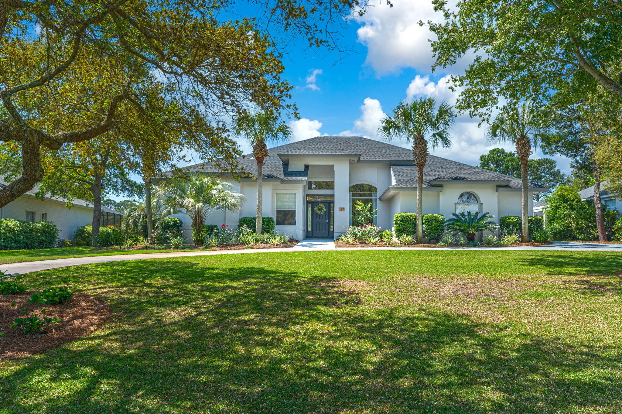 Southern living and a coastal lifestyle combine in this elegant and pristine pool home, located in a golf course community in East Destin. Upgrades await you in this well-appointed home. A large welcoming foyer brings you to the wide-open great room, with views of the 5th tee box on Indian Bayou Golf Course. This home has undergone an almost complete transformation in the time the sellers have owned it. A neutral paint palette will appeal to the most discerning buyer, as will the new LVP flooring. The gourmet kitchen was completely remodeled, featuring new cabinets, counters, backsplash, and a brand new kitchen island overlooking the living room and an amazing view of the golf course. The spacious, welcoming master retreat is separated from all other bedrooms in the home. Plush carpet flows through the bedroom, ending at the spa-like master bathroom. The grand master bathroom features separate vanities, a colossal walk-in shower, separate garden tub, and dual walk-in closets. Your outdoor oasis awaits with the heated pool (with new equipment in 2019). Sip your coffee in the morning and listen to the birds in the trees, or wind down in the evening with a glass of wine and enjoy your enclosed patio. Other major items of note: the roof was replaced in 2021, and HVAC was replaced in 2020. Come live the Destin lifestyle, and make this one yours today!