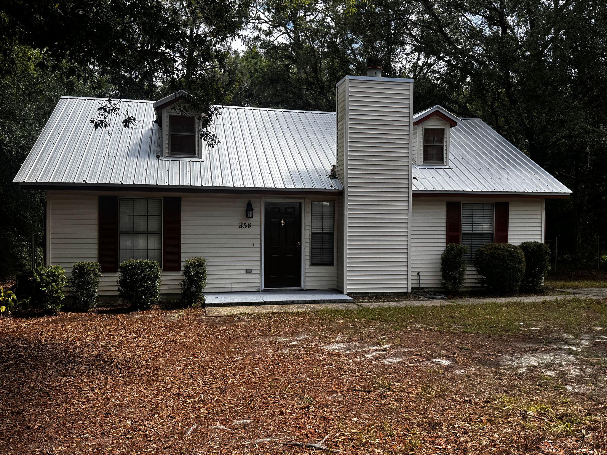For Rent | 358 John King Road, South Crestview, FL 32539

Welcome to this beautifully updated 3-bedroom, 2-bathroom home located in South Crestview, offering a peaceful setting with unbeatable convenience. Ideally positioned for easy access to military bases, local schools, shopping centers, and restaurants, this home is perfect for those looking to stay connected.

The interior has been freshly painted and features stylish new light fixtures that brighten every space. The spacious living room offers beautiful hardwood flooring, a cozy fireplace, and a ceiling fan for added comfort. The kitchen is fully equipped with newer stainless steel appliances, ample cabinetry, a mosaic tile backsplash, and tile flooring for easy maintenance. The primary bedroom features its own private bathroom, creating a relaxing retreat. Two additional guest bedrooms share a full bathroom, offering comfort and functionality for family or guests.

Step outside to enjoy the expansive fenced backyardperfect for entertaining, gardening, or letting pets play freely. A large deck provides plenty of room for outdoor dining or lounging, and an outdoor building adds valuable storage or workshop space. Additional upgrades include a newer air conditioning system and a durable metal roof.

Pets may be considered on a case-by-case basis with prior owner approval and a non-refundable pet fee. Please note that this is a smoke-free and vape-free property.

Don't miss the opportunity to live in this updated, move-in-ready home in a prime South Crestview location. Contact us today to schedule a showing!